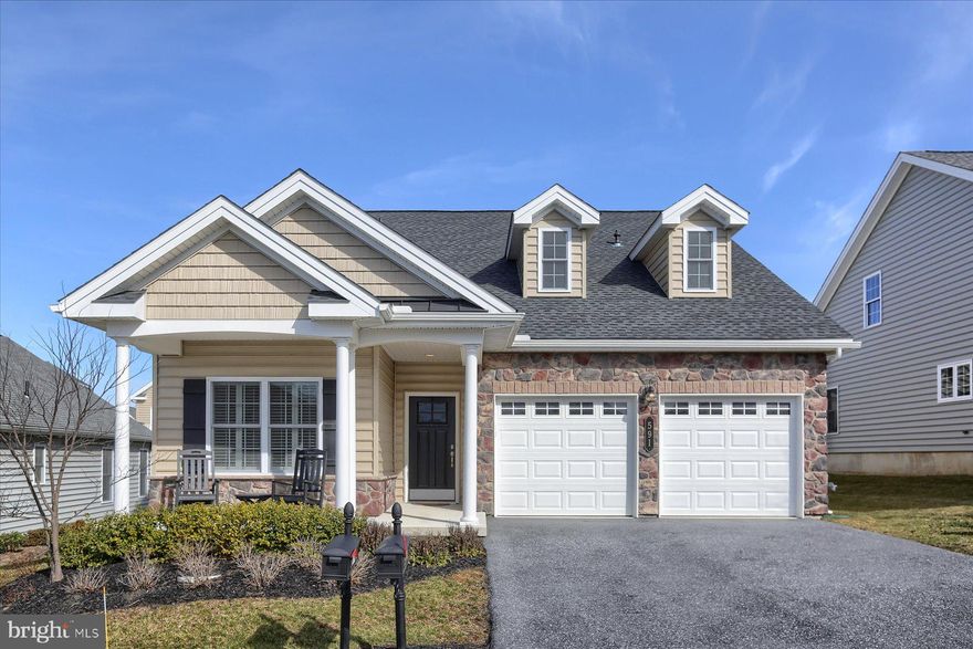 Welcome to 591 Allegiance Drive! This beautiful home features a stone veneer upgrade and stately pillars to define a cozy front porch that welcomes you to take a closer look. The inside of the home is tastefully appointed. The atmosphere is soothing and classic with a pleasing muted color scheme throughout and carefully selected upgrades including: a gourmet kitchen with impressive vent hood over a gas burner stove top, farm style sink, large 8-sided island with a beautiful unique countertop, stainless steel energy efficient appliances and custom window coverings. The rich hardwood floor flows from the entryway through the kitchen and dining area into the comfortable living room with its impressive wall of windows and gas fireplace. The spacious master suite retreat features a tray ceiling, large windows and walk-in closet. The private master bath has a tiled walk-in shower, double sinks and lovely granite countertops. The front bedroom can serve as a cozy guest room or first floor den/office space. An additional full bath and laundry room complete the main floor. 
The second floor boasts of a large loft area overlooking the living room below and offers a dramatic view. The loft is large enough to host a well equipped home office space and family room for your guests to enjoy along with their private bedroom and bathroom. The outdoor living space is perfect for entertaining family and friends. The large deck and newly installed paver patio with its curved wall set the stage for friendly barbecues and get togethers.
This desirable home is located in the popular Traditions of America at Lititz community.  Plan your visit today!