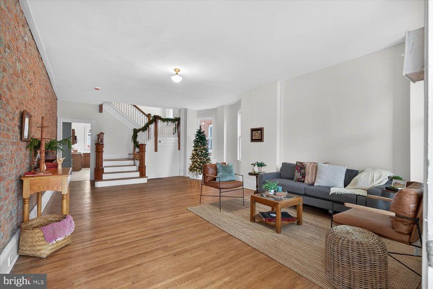 Welcome to 980 E Orange Street, a beautifully renovated home showcasing exposed brick, rich hardwood floors, and a spacious, inviting layout. This move-in-ready property features an updated kitchen, four bedrooms, and two bathrooms, including a finished third-floor space that offers two of the four bedrooms—perfect for added privacy or flexible use. Enjoy the convenience of off-street parking and a backyard, making this home the perfect blend of style, comfort, and functionality in a desirable location.