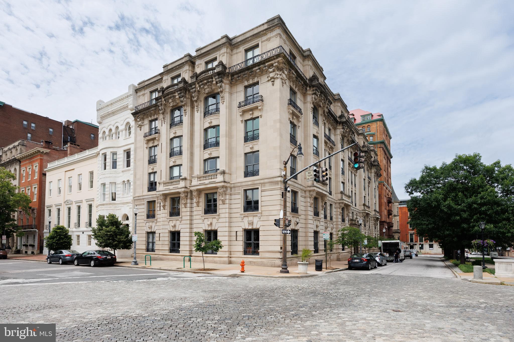 Elegant Historic Living at 700 Washington Place – Mt. Vernon’s Crown Jewel
Welcome to 700 Washington Place, Apartment 4B, located in one of the most prestigious and architecturally significant buildings in Baltimore’s historic Mount Vernon neighborhood. This rare 3-bedroom, 2-bath residence offers an exceptional opportunity to own a piece of history with over 2,000 square feet of living space, stunning architectural details, and sweeping views of some of the city’s most iconic landmarks.
Step inside this beautifully preserved Beaux-Arts masterpiece, where timeless elegance meets modern convenience. Apartment 4B retains its original finishes and historic charm, including a marble fireplace mantle, deep crown molding, and oak floors with mahogany inlay. The layout includes a formal living room, music room, dining room, and a kitchen with butler’s pantry—complete with in-unit laundry and updated appliances.
The primary suite features generous closet space, large French doors, and a modern ensuite bath. Two additional bedrooms offer floor-to-ceiling closets and share a second full bath, ideal for guests or family living.
Enjoy views of Mt. Vernon’s treasured landmarks—including the Washington Monument, Peabody Institute, Garrett-Jacobs Mansion, and Mount Vernon Place United Methodist Church—from your windows.
This cat-friendly building offers unmatched amenities:
Monthly fee includes property taxes, heat, 24-hour security, doorman service, six-day-a-week trash and delivery pickup (directly from your kitchen closet), water & sewer, building maintenance, and insurance
Owners are only responsible for electricity and internet
Perfectly situated just steps from Penn Station, Johns Hopkins University, the Peabody Institute, and the vibrant dining and arts scene along Charles Street, this home places you in the heart of culture, history, and convenience.
Own a piece of Baltimore’s rich architectural legacy—schedule your private tour of 700 Washington Place, Apartment 4B today.