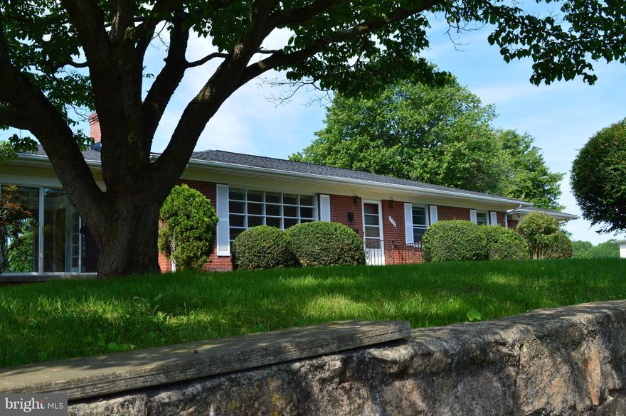 Peaceful Rancher on a lovely .50 acre lot right in town! Enjoy this large shaded lot with mature trees. This well maintained home offers a New Roof as of May 2017, Screened in Porch, Hardwood Floors, Family room w/ a Fireplace, Finished Bonus Room on Main Level. The Basement is fully finished with a Full Kitchen, Washer and Dryer, Living room w/ a Fireplace, 2 bonus Rooms and a Full Bath!