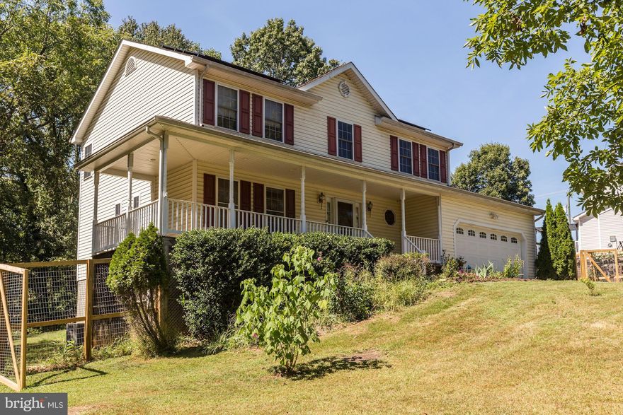 Welcome Home!  This 4 bedroom, two and 1/2 bath home has new paint, well-maintained, and move-in ready!! This home uses solar energy and is registered with Dominion Power as a Certified Residential Net Metering and is grid connected.  Propane tank is owner owned with ownership conveying so you can buy propane more cheaply.  New heat pump relegates propane gas to emergency heat only.  2 new zone thermostats are 2-fuel capable and ready, allowing you to switch between the two and remotely change the inside temperature setting using a cell phone app.  House is Generator Ready and off-grid ready with manual transfer switch (MTS, critical load panel, LG battery back-up, and 9.9 KW solar system comprised of 33 30x300 W panels), which significantly reduces electric bill and reduces need for propane usage to emergency only.  Industry Standard design. Raised beds for gardening. Deer-proof fencing ($16k!). Newer HVAC and electric Water Heater (backed up by solar) Large lot, Pesticide-free lawn care for several years, 2 New smart thermostat/smoke detectors and Smart garage-door opener.  Hurry!! This property won't last long!!