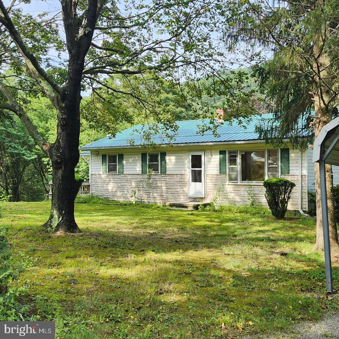 THIS UNRESTIRCTED FARM IS A RARE FIND THAT CONSISTS OF 44.379 ACRES, 14 FENCED ACRES, A POND, A STREAM, AND A SPACIOUS RED BARN READY FOR CATTLE, HORSES, OR OTHER LIVESTOCK. THE RANCH STYLE HOUSE IS 3 BEDROOMS, 1 BATH WITH A FULL UNFINSHED BASEMENT. OTHER BUILDINGS CONSIST OF A LARGE TWO STALL BLOCK GARAGE WITH A ROOT CELLAR, AND VARIOUS SMALL BUILDINGS PREVIOUSLY USED AS STORAGE SHEDS AND SMALL CHICKEN HOUSES. THE PROPERTY ALSO BOASTS A POND AND A YEAR AROUND INTERMITENT STREAM; IN ADDITION, IT HAS A LARGE SIDE YARD THAT CONTAINS VAROUS FRUIT TREES AND A GRAPE VINE. THIS PROPERTY IS TRULY UNIQUE IN TODAYS MARKET AND IS ONLY A STONES THROW TO U.S. RT. 50 AND ONLY 25 MINUTES TO WINCHESTER. LOW WV TAXES AND WITHIN 1 ½ HOURS TO THE DC METRO AREA. “NO RESTRICTIONS/NO HOA”