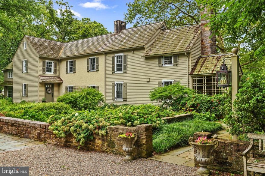 Armitage House has sat proudly on its six acres since 1750. Beautifully restored, the home has transcended time with grace and sophistication. Enter down a long stately drive, over a stone walled lined stream and you will arrive at the spectacular first tier of gardens. The home is in remarkable condition and the main floor offers a separate kitchen with dining and an aesthetically pleasing fireplace. The main living space is open in concept allowing flexible dining and  seating areas. This lovely beamed room iis anchored by a fireplace encased in museum quality Mercer Tiles and a wall of French doors leading to the sizable stone patio and gardens. An adjacent sunroom/office is enveloped by French doors providing ample light and magnificent vignettes of the landscaped grounds. The expanded landing of the second level provides a quiet reading nook.  The sunny and comfortable master bedroom has ample storage and a charming,  spacious sitting room/office addition. Two to three  bedrooms and two baths complete the second level.  The third level provides plenty of room for storage or expansion.   The gardens, dining patios, water feature and great lawn create an ambiance of your own private park. One of the most stunning features on this property is the amazing half moon in-ground pool. The pool seems to immerge out a stone wall and is surrounded by a bluestone patio for sunbathing. The entire concept is architecturally innovative. The property contains a number of stone dependencies, notably, a stone garden house currently the owners office, where the  creek provides a peaceful backdrop.  A stone gardening/storage building, The Carriage house has a 2-car garage and media room above. Stone walls and a stone aqueduct enhance the stream that runs through the property. Armitage House is located in one of the most coveted areas of New Hope/Solebury. It has both the aesthetics and the pedigree of a cherished Cotswold Cottage. Recent upgrades include a modern septic system, upgraded electrical service, and high-speed internet service.