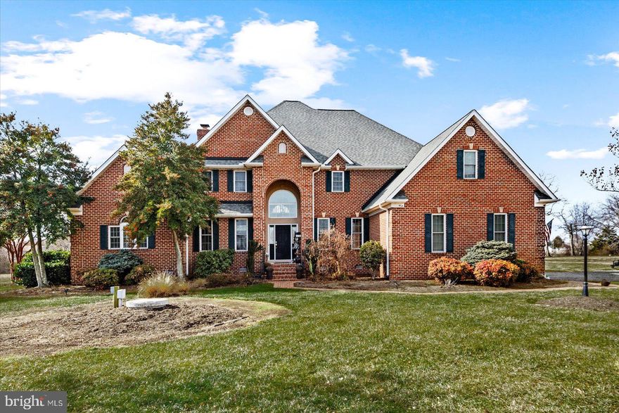 Wellcome Home! Waterfront Luxury Living at 257 Church Point Lane, Colonial Beach, VA 22443.
Experience unparalleled elegance in this custom-built brick home situated on a serene 2.93-acre waterfront lot in the prestigious Church Point community of historic Westmoreland County. This expansive residence offers 3,850 square feet of meticulously designed living space, featuring 4 bedrooms and 3.5 bathrooms. The open-concept floor plan seamlessly connects the living, dining, and kitchen areas, creating an ideal space for both relaxation and entertaining.  A chef's dream, the kitchen is equipped with high-end appliances, custom cabinetry, and ample counter space. The main level master bedroom offers stunning  views, two generous walk-in closets, and a spa-like en-suite bathroom with dual sinks, a soaking tub, and a separate shower. Step outside to a private patio and a separate screened in porch that leads to the tranquil lake, perfect for boating, fishing, or simply enjoying the natural beauty. The home includes a two-car garage, whole home generator, central air conditioning, and an in-unit laundry room for added convenience. Church Point is a sought-after community known for its peaceful ambiance and proximity to local attractions. Residents enjoy easy access to Colonial Beach's shops, dining, and recreational activities, all while being nestled in a tranquil, nature-filled environment.