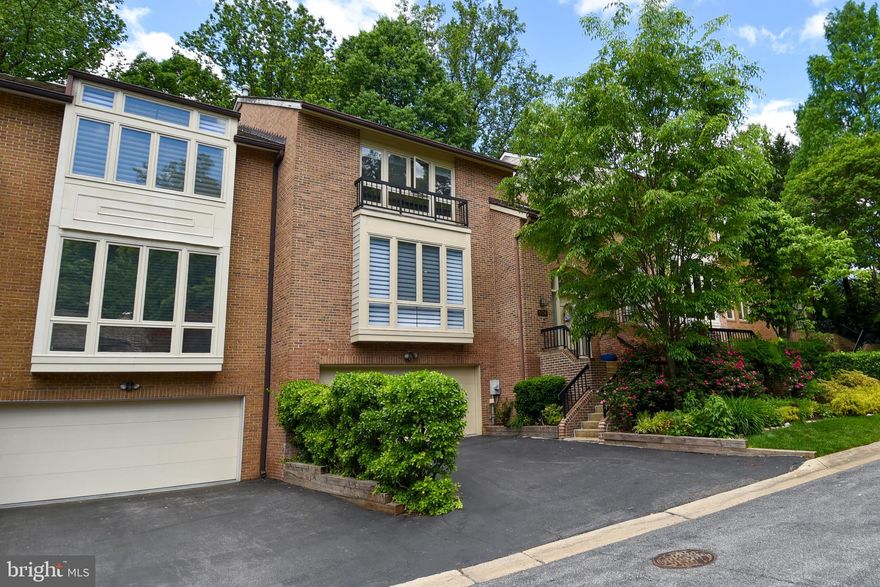 Welcome to this stunning and spacious Bethesda townhome, offering a private and peaceful oasis with beautiful views of trees and garden from the many large windows, deck, and patio. 
Light-filled and with over 4,000 square feet of finished space on three levels, this residence was also built to accommodate an elevator (see closet space behind stairway on floor plan). It is the largest townhouse model in the community with soaring ceilings, skylights, generous room sizes and lovely traditional detail. It feels like a detached home, with fabulous flow for everyday living as well as entertaining. Renovated with exceptional craftsmanship and attention to detail, ready to move in! 
The entry level features a gracious living room with beautiful windows, a spacious dining room, a large renovated chef’s kitchen with breakfast area and access to the deck, patio and green space beyond, a wonderful study/family room with fireplace also overlooking the deck, a laundry room and an updated powder room. 
Upstairs, the primary bedroom offers a large walk-in closet and a beautiful renovated en suite bath with separate shower and whirlpool tub, double sinks and a skylight. Two additional nice-sized bedrooms, each one with a complete and renovated en suite bathroom complete the upper level. 
The lower level with high ceilings offers a large recreation room with fireplace and a skylight, a fourth bedroom, a full bath and a large storage or utility room/workshop, and access to the 2-car garage. 
Beautiful neighborhood, conveniently located with quick access to DC, downtown Bethesda and the beltway, in the desirable Walt Whitman School district. Nearby parks and recreation, including Merrimack Park and Merrimack Pool are also popular with neighborhood residents, who can take advantage of access to the Towpath and Capital Crescent Trail as well. Don’t miss this is a great opportunity!