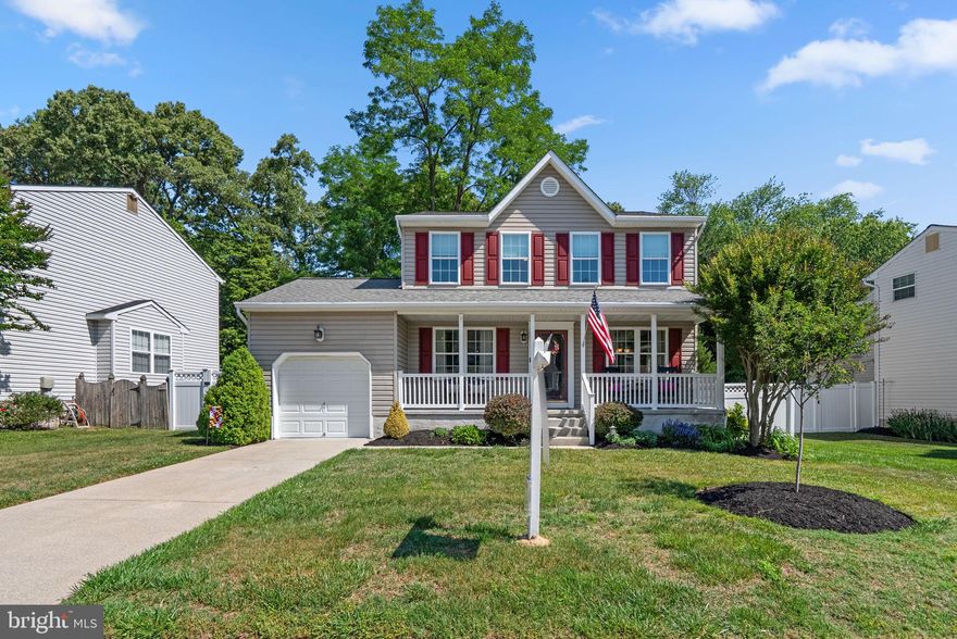 Charming Colonial-style residence offering 3 bedrooms, 2.5 updated bathrooms, and 1,700 finished square feet in desirable Barcroft. Freshly painted shutters, double-pane Pella windows installed in July 2025, and a recently updated front porch create inviting curb appeal and welcome you inside the bright open-concept main level. // Hardwood floors begin in the foyer and extend throughout the formal living room and formal dining room, creating a warm and cohesive atmosphere ideal for both everyday living and entertaining. The spacious family room features newly installed carpeting, a recently added ceiling fan, and updated French doors with integrated blinds that open to the backyard. Seamlessly connected to the eat-in kitchen, the layout offers an exceptional flow for entertaining, with a conveniently located powder room nearby. The beautifully updated kitchen is appointed with hardwood floors, shaker-style cabinetry enhanced by newly installed under-cabinet lighting, a peninsula breakfast bar, stainless steel appliances, a classic subway tile backsplash, and a cozy sunlit breakfast area perfect for a bistro table or casual dining. // Upstairs, the upper level offers three newly carpeted bedrooms and two full bathrooms. The spacious primary suite includes a recently installed ceiling fan, a walk-in closet with a custom organization system, and a private en-suite bath featuring a relaxing air tub. The additional full bathroom has been gorgeously renovated. // The lower level provides a blank canvas ready for your customization and future expansion. This space includes laundry facilities, walk-up exterior access with updated exterior lighting and an updated French door, a recently replaced sump pump, upgraded electrical and plumbing components, additional insulation, and fresh paint for added peace of mind. // The backyard is truly the showpiece of the home, offering an enchanting outdoor retreat filled with thoughtful details. Highlights include a curved stamped concrete patio, a newly installed Trex® deck (2025), meticulously maintained landscaping, including newly planted trees and shrubbery with charming fairy lights woven throughout the trees, a tranquil fish pond, privacy fencing, and a storage shed with electricity and a motion-sensor spotlight. Backed by preserved woods, this setting creates a magical ambiance for outdoor entertaining or peaceful evenings at home. Completing the property is a 1-car garage with impressive 11-foot ceilings, epoxy-coated flooring, upgraded garage door opener, and additional storage space.