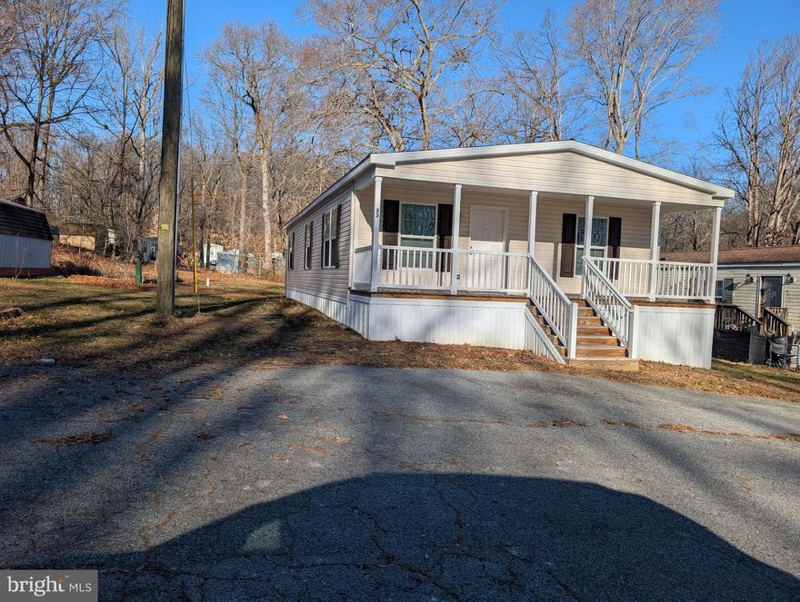 2024 never lived in Double Wide. 3 Bedrooms, 2 Full Baths. Off Street Parking. Must have park approval. Lot Rent Currently $661.38 per month includes water, sewer and trash removal. Backs to trees