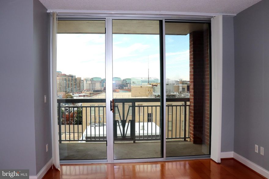 Stunning 1BR/1BA condo in the heart of Clarendon! Large living area and balcony with fantastic West view. Meticulously maintained, it looks and feels like a new unit. Nice sized bright bedroom with spacious closet.  New window treatments, hard wood floors in living area and carpet in bedroom.  The unit is ideally located three blocks from Clarendon Metro and Trader Joes. Perfect for active lifestyle. Walking distance to several restaurants and shopping.   Rent includes one parking spot in underground garage, water and trash. Amenities: concierge, outdoor pool, library, fitness rooms & community center.