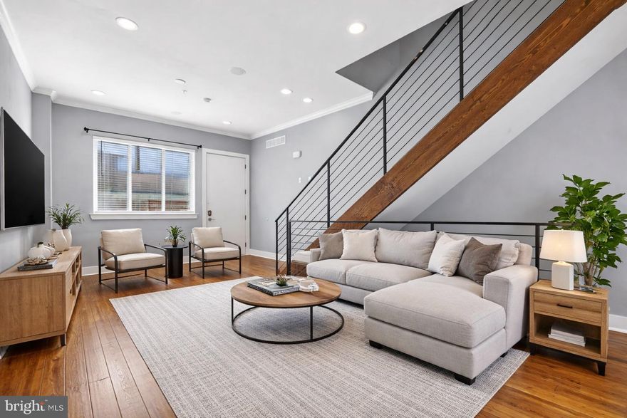 Located in the heart of South Philadelphia’s rapidly growing landscape, this home offers walkable access to Dock Street Brewery, On Point Bistro, Sardine Bar, East Passyunk Square, Washington Avenue, Broad Street, and more. Inside, a contemporary open floor plan features hand-scraped bamboo flooring, crown molding, and custom millwork throughout. The gourmet kitchen includes a large island, high-end Samsung stainless steel appliances, soft-close Shaker cabinetry, and stone countertops. Bathrooms are finished with porcelain and marble tile, seamless glass showers, freestanding tubs, and rainfall showerheads. The primary suite offers a spacious bedroom with a bay window and a walk-in closet. Enjoy a private rooftop deck with sweeping skyline views—ideal for relaxing or entertaining—along with smart home features including Nest, Schlage keyless entry, and a Ring doorbell. Additional highlights include Bluetooth surround sound, USB outlets, and a full backyard. Approximately 6 years remain on the tax abatement, offering meaningful savings (see tax office for specifics) With Philadelphia set to host matches for the 2026 FIFA World Cup, the 2026 MLB All-Star Game, and events tied to the United States 250th Anniversary, the city continues to gain national attention—supporting long-term growth and investment potential. Financing options may be available, including programs offering low down payment structures and potential closing cost assistance. Inquire for additional details. * House has been virtually staged *