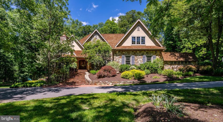 Enjoy country living at its finest in this wonderful Kennett Square home that comfortably accommodates any size family! Located in a beautiful woodland setting, in a private oasis set far back from the road, the striking stone gem sits on a lush 5-acre lot enveloped by flowering trees & exquisite landscaping. While the environs are very private, you re close to great attractions, in a quaint town with farm-to-table restaurants, good schools & varied activities. Only a mile away is Longwood Gardens consisting of 1,077+ acres of gardens, woodlands & meadows, featuring special events & performances. You re also just 15 minutes from the Wilmington train station, a few miles from Chads Ford & accessible to Downtown Philly in a little over an hour.Staying home is fabulous too, especially in summer when you can relax & have fun in your backyard oasis with a heated pool, Jacuzzi and spacious patio surrounded by trees & greenery. There s lots of space for grilling & lounge chairs, even a customized pool house for equipment. The wooded backyard provides a peaceful path for walking through the woods.Inside is inviting and lovely, with specialized features in every room and a resort-style flavor. This is particularly evident in the family room with cathedral ceiling, barn beams, and fireplace encased in a stone wall with a huge beam built into the mantle. Custom built-ins, heated English oak hardwood floors, bathrooms with heated floors, 2 offices spaces, 2 family room spaces, and the option of the master suite on the 1st or 2nd floor make this home that much more unique. The flow is made for entertaining, with the main family room open to the breakfast area & kitchen, and a convenient wet bar at hand. Off the foyer is a living room with built-ins & stone fireplace & a formal dining room. A connected butler s pantry provides easy serving from the gourmet kitchen with granite counters & island, and high-end appliances. Retreat to the master suite with a gas fireplace, oversized walk-in closet (with a cedar closet inside!), and stunning bath clad in stone & tile with a Jacuzzi tub + upgraded shower with multiple jets & hand-held spray. The walkout basement with heated wood floors is casual & inviting, with a 2nd family room, office, bedroom, full bath, wine cellar & work space. Other highlights include a partially-heated driveway, whole-house generator & extensive camera system!