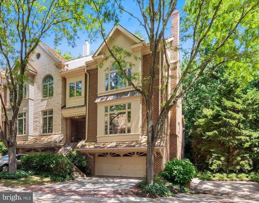 Nestled in a beautifully maintained enclave just blocks from the C&O Canal, Sibley Hospital and the DC border you will find this stunning one-of-a-kind end unit townhouse. This house boasts luxe details, modern finishes, soaring ceilings, ample entertaining space and tranquil sounds of the Potomac River Tributary. The foyer opens to a sun-drenched living room with a fireplace and hardwood floors throughout. The open floor plan allows easy access to the dining area, sunroom and serene balcony overlooking the woods with views of the water. The gourmet eat-in kitchen features custom lacquer paneled top-of-the -line appliances, gorgeous  granite countertops, a large center island and a sun filled breakfast nook. A spacious dining room, a chic recently upgraded powder room, a den and easy access to the large balcony complete this level. The upper level features a luxurious, vaulted ceiling master bedroom with a newly renovated expansive walk-in closet. Two more generous size bedrooms another full bathroom and a laundry shoot to boot!  Rounding out this exceptional home is the lower level with a wonderful recreation room, expansive bar, den and full bathroom. All this plus a two car garage and a location that can't be beat.