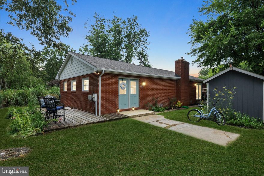 Nestled on a serene peninsula surrounded by the Chesapeake Bay and Fishing Creek, this beautiful 
3-bedroom, 2-bath ranch-style home offers the best of one-level coastal living in the sought-after community of Arundel on the Bay.  From the house, you’ll enjoy peeks of the Chesapeake Bay and the convenience of being less than one block from the water. Paired with a neighborhood rich in waterfront amenities, it feels like a peaceful retreat—yet you’re just under four miles from Historic Annapolis. 
Inside, the open-concept kitchen was fully renovated in 2020 and features granite countertops, soft-close cabinetry, an induction cooktop, and a Bosch convection oven. The kitchen flows seamlessly into the living and dining areas, where white maple hardwood floors and modern lighting create a bright, cohesive feel throughout.
The flexible layout includes a thoughtfully added third bedroom and a stylish full bath with slate flooring, subway tile shower, and a modern glass enclosure. The spacious primary suite offers its own full bath and a walk-in closet that not only provides ample storage for clothing but also includes a full-size front-loading washer and dryer. Sliding glass doors in both the primary bedroom and second bedroom fill the home with natural light and provide access to the outdoors.
Cozy up by the high-efficiency wood stove with blower during cooler months and enjoy indoor-outdoor living in warmer seasons with the walk-out deck and level yard. The home also includes a newer roof (2019), fresh interior paint, and a storage shed.
Arundel on the Bay offers an unparalleled waterfront lifestyle with access to a private community beach, boat ramp, pier with slips (check for availability), kayak and canoe storage, and a neighborhood playground. Enjoy the quiet charm of this hidden gem community while staying within easy commuting distance to Washington, D.C., Baltimore, and BWI.