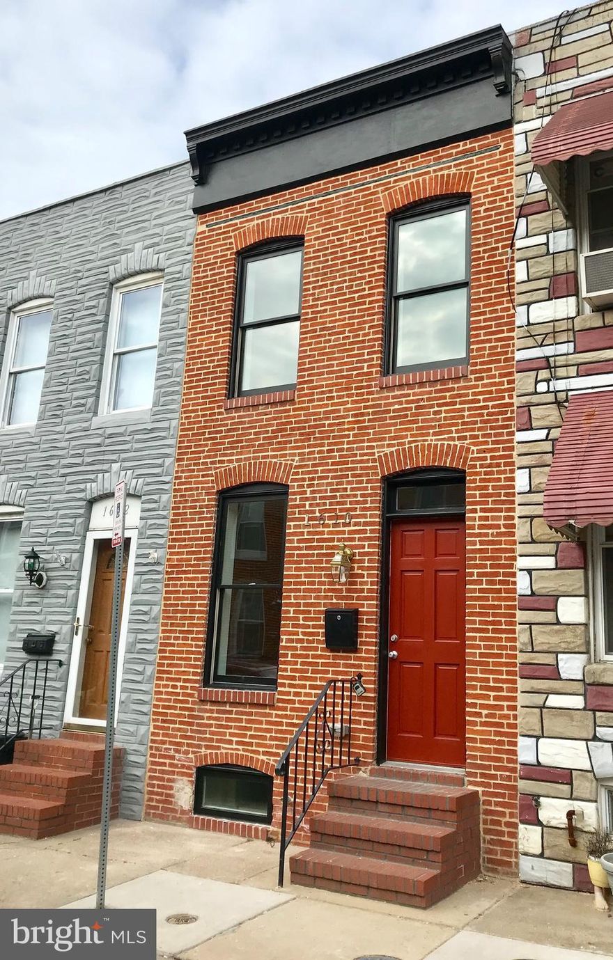 Beautiful house w/10 full years of CHAP tax credit. On main level enjoy spacious living room, half bath and a beautiful gourmet kitchen with SS appl and granite.Upper level has 2 bed 2 full baths PLUS den great for nursery/office and a large rear deck! Lower level Bedroom for guests or family room and Laundry room. HW floors. Wide upstairs with natural light! Rear parking pad.