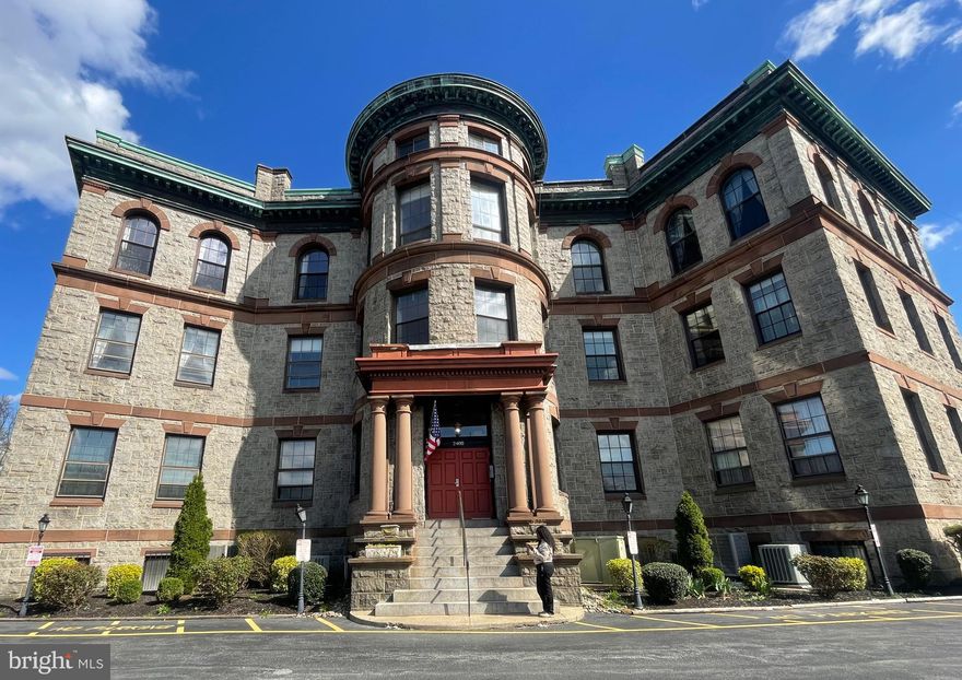 Fantastic opportunity in the Baynard House condominiums that will  check all  your boxes!
The open-concept floor plan features an updated kitchen and bathrooms, beautiful oak hardwood floors throughout, and soaring 13-foot ceilings adorned with original pressed metal crown molding and ceiling ornamentation. Large 44”x82” windows flood this stunning corner unit with gorgeous light all day long! Unit 11 is a single-level condo with elevator access. (or use the stairs for the free built-in exercise plan!) 
Located on the 3rd floor of this 4-story building, Unit 11 includes a primary bedroom with en-suite bath & a handsome custom closet, complete with interior lighting, built-in drawers, and shelving. 

The entry for this unit is right off the elevator and staircase. So convenient! Built like a fortress, the Baynard House condo boasts massive 16-inch thick granite stone walls. It was originally a School that was converted in the late 70s to configure 16 unique condos. There are street access doorways for furniture delivery with easy access to the elevator which is also available for residents/guests who may prefer an access with no steps.
Additional features include a deeded off-street parking spot, in-house laundry, and an elevator. There’s also extra in unit storage available in the attic via pull-down steps. Recent kitchen upgrades include a newly installed “Spring Water” filtration system, a smart hands-free gooseneck faucet, a deep enameled black Onyx sink, New Solid Quartz like countertops, a stylish glass tile backsplash, upgraded cabinetry hardware, a pantry cabinet, soft-close drawers, Badger Garage Disposal & Elite stainless steel appliances. 


The much-loved Scout Café/Coffee Shop is right out your door! Wilmington Brew Works, Metro Pizza and Sleeping Bird Coffee are right up Baynard Blvd too. 
Enjoy many restaurants and night clubs near-by in Trolley Sq, & Wilmington Business district. 

Just a few blocks south, across the Brandywine is The Opera House/ The Queen/ YMCA/ Wilm. Library/ Post Office/ Christinia Hospital. Towards Trolley Sq is the DE Theatre CO./ DE Art Museum/ Brandywine Creek Park/ Brandywine Zoo/ Dog Park. Alapocas Woods & the Greenway Trails are all very near-by as well for miles & miles of wonderful trails. You can have a blast Canoeing, Kayaking, Rock Climbing & Trail Biking, all so nearby! Inquire with agent regarding an outstanding Grant Program, which gives 3% toward your down payment and up to 7500 toward your closing cost for a 3% down conventional loan. This is not 2nd loan, like many are that need to be paid back when you sell. If you haven’t purchased a home in the past three years, you would qualify as a First Time Buyer. 1st time Buyers only pay .75% Transfer Tax! All this plus NO Sales Tax in DE. NOW we are TALKING!!!