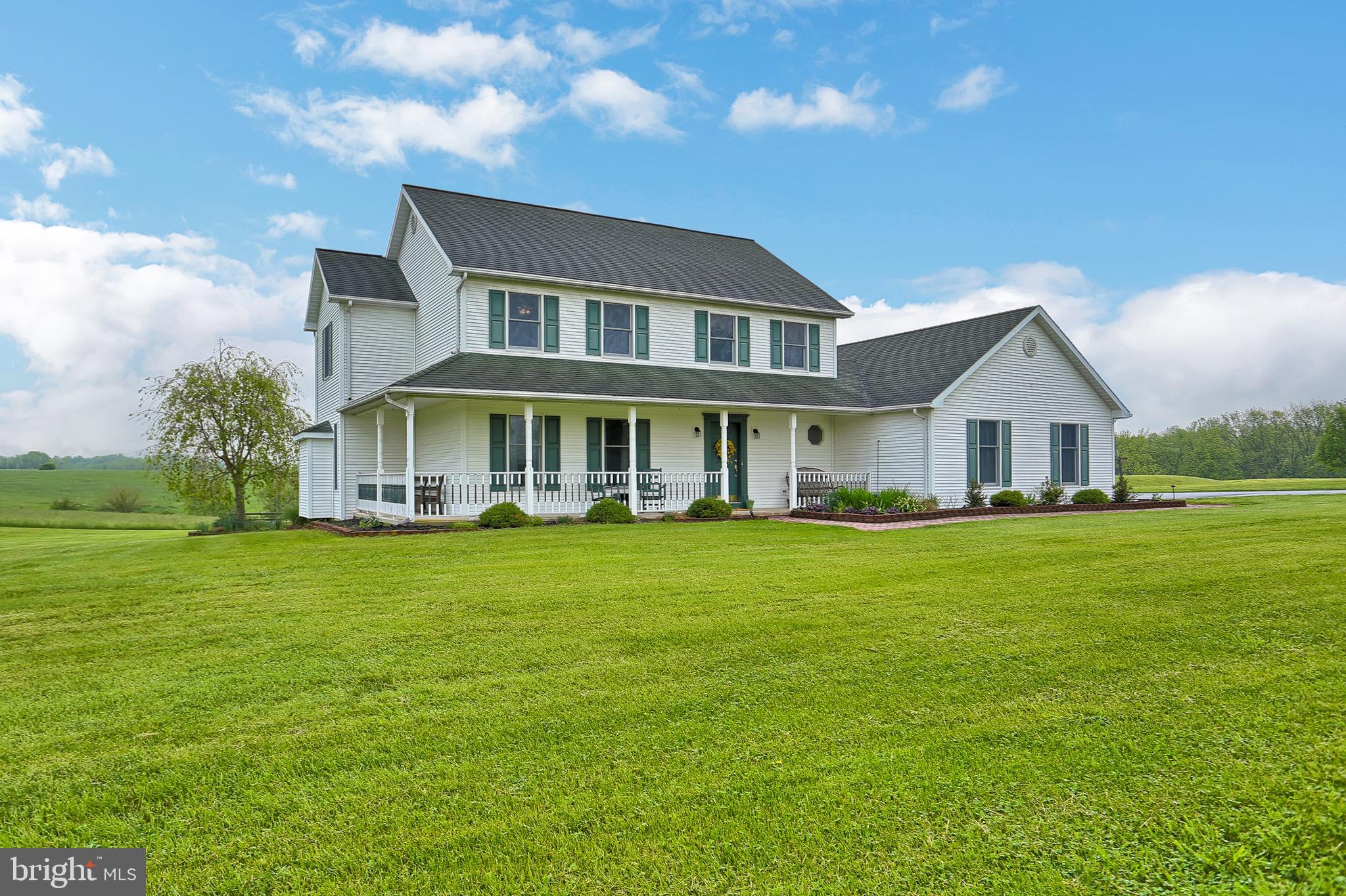 Updated and Private 4/5 bedroom home on almost 5 acres! Updated eat-in kitchen w/granite countertops, tile backsplash and flooring. Family Room with gas fireplace. Living Room w/hardwood floors. Fully finished basement could easily be in-law suite- already has large bedroom, game room and kitchen. Panoramic views of the mountains from the rear deck! Covered front porch. Oversized 2 car garage. 1st floor laundry room.  Newer heat pump and new well pump. This home has been meticulously maintained!