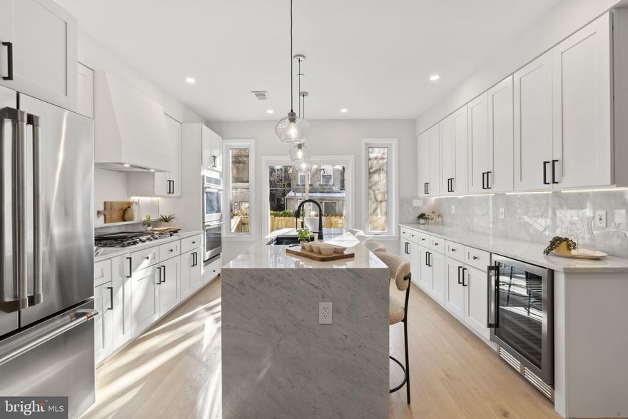 Experience luxury living in this 4 bed, 3 bath new construction home in the heart of Graduate Hospital. The striking white brick facade with black accents sets the tone for a thoughtfully designed interior that blends timeless character with modern comfort. This home features dual-zoned HVAC, GE Café appliances, a 36 inch stove, custom cabinetry, designer millwork, Venetian plaster backsplash & hood, marble countertops, and much more. The third-floor primary suite is a true retreat, featuring a spa-like ensuite bath with a custom shower, dual rain heads, and a soaking tub, along with a custom walk-in closet designed for maximum storage and organization. A fully finished lower level with a bedroom and full bath adds valuable flexibility. The generously sized backyard offers great space for relaxing or entertaining. The private roof deck with panoramic city views completes the home. Just steps from Sidecar Bar, Ultimo Coffee, and a short walk to Rittenhouse Square, this residence delivers the best of Center City living with neighborhood charm. Fully approved 10 year tax abatement included. 1-year pre-paid parking offered at the buyer's location of choice.