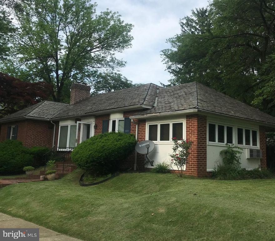 Corner Lot Location!!!  House has beautiful hardwood floors . Wood burning fireplace & Bay Window in living room Dining room with built-in glass front china closets, kitchen with ceramic tile floor and breakfast bar. There is a side addition which is the family room with brick tile floor. Basement has large paneled club room with built-in cabinets, workshop and double laundry tub in laundry room.