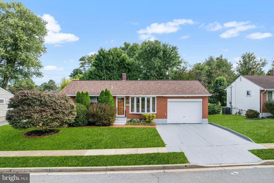 Come see this great 3 bedroom, 3.5 bathroom brick rancher located in sought after Randallswood with upgrades galore!   This well maintained home is a lot larger than it looks from the outside, with over 2,700+ square feet of living space, it goes on and on.  When you come in the front door you'll be in the welcoming living room with a huge bay window to let in all of the light, crown and chair molding, and ceiling fan.  Next is the formal dining room, also with hardwood floors and beautiful dental crown molding.  The kitchen is complete with BRAND new stainless steel appliances, newly tiled floor, double sink and recessed lighting.   Down the hall is the 1st full bathroom, which is generously sized and has a corner jetted tub, separate walk-in shower, custom tile, and a large two-sink vanity.  Keep going and you'll see the primary suite with a large walk-in closet, ceiling fan, recessed lights and en-suite bathroom with tile from the floor to the ceiling.  Then a home office, slider out to the huge backyard, that is fully fenced and also then a home gym.   Don't miss the door out to the 2-car tandem garage, that also has a lot of space for a workbench and storage.  The main level also has 2 other bedrooms and a 3rd full bathroom with a 2nd jetted tub, it truly has  a ton of space on this main level.  The lower level is finished and has new LVP flooring throughout.  Here is where you will find a large family room area and another large living room, a half bathroom, recessed lighting, large utility/laundry room, another room that could be a home office or gym, and lots of storage options as well.  Also, the home office and home gym could  both be used as bedrooms.  There are built-in speakers in multiple locations in the home, including the kitchen/dining area and the lower level as well.  ROOF 2023, AC 2024, HWH 2024, Kitchen appliances 2025! The roof is only two years old, and the house is wired for sound, perfect for entertaining or enjoying music throughout.  All of this and the location is close for commuters:  795, 695, I-70 and 95.  Close for shopping and dining too!  Check out the virtual tour!