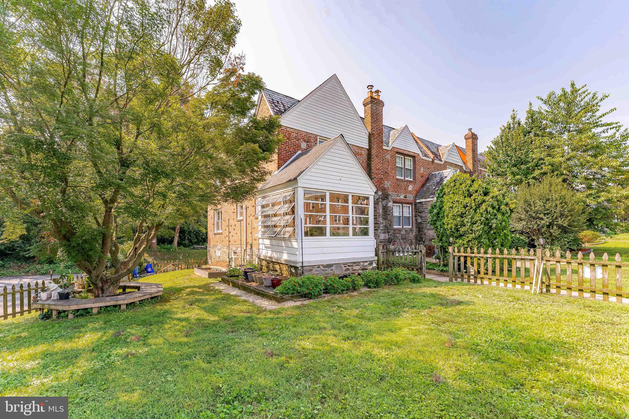Welcome to 2300 Highland Avenue, a charming 3-bedroom, 1.5-bath end-unit rowhome situated on a corner lot at the end of a quiet cul-de-sac. With its classic picket fence and brick front, this home offers character, convenience, and curb appeal. As you approach the property, you’re greeted by an inviting enclosed front porch with tile flooring—perfect for relaxing or greeting guests. Step inside to the main level where the cozy living room features a coat closet and two built-in bookcases, adding both charm and functionality. An arched entryway leads to the dining room, filled with natural light from windows overlooking the backyard. A ceiling fan with lights adds comfort, while a peninsula overhang from the kitchen creates a seamless connection between the two spaces. The kitchen offers tile flooring, maple-colored cabinets, and GE stainless steel appliances, along with access to the basement for added convenience. Upstairs, a central hallway includes a linen closet and leads to three well-appointed bedrooms. The primary bedroom features a ceiling fan with light and a walk-in closet. The full bathroom includes tile flooring and a tub/shower combination. Two additional bedrooms—each with hardwood floors and ceiling fans—are ideal for children, guests, or a home office. The unfinished walk-out basement includes a powder room with tile flooring and houses the home's utilities, including a washer and dryer. The basement also provides access to the garage. Conveniently located near local shopping, grocery stores, and restaurants, this home also offers quick access to West Chester Pike, making commuting simple and efficient. Don't miss the opportunity to call this wonderful home your own!
