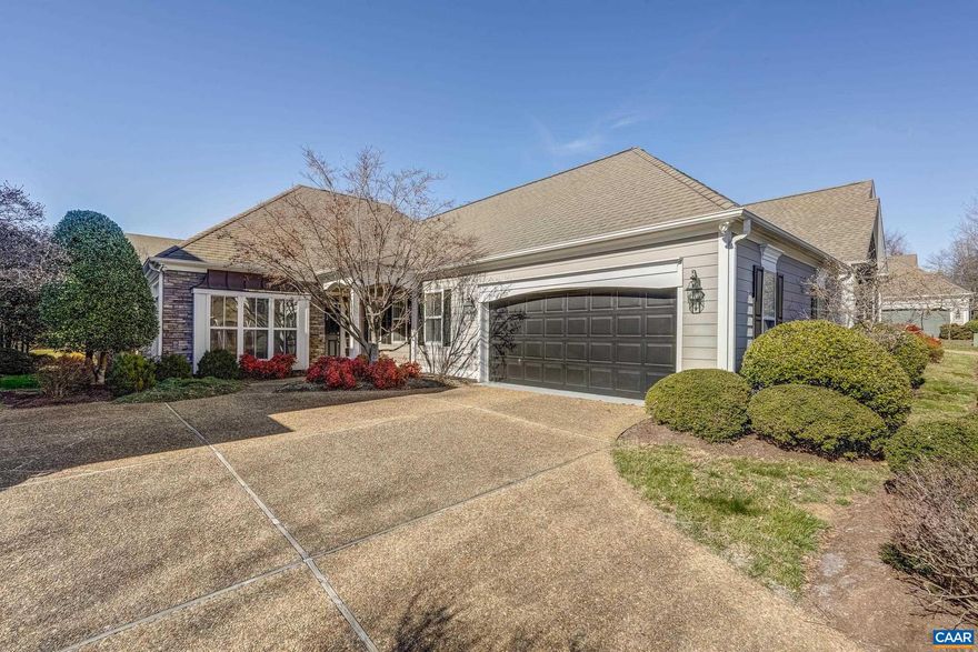 Enjoy convenient one level living in the Stone Gate Community of Western Ridge. Cathedral ceilings accentuate an attractive living room that connects with the sun room that share a double sided gas fireplace. The primary bedroom has floor to ceiling windows, tray ceiling and spacious private bath. The kitchen has ample maple cabinetry for storage, center island, eating bar and a recent upgrade for the appliances. The laundry room contains full size washer & dryer and large utility sink.   Additional storage is available in the walk-up attic that can also be finished at a later date. You will appreciate that landscaping & exterior painting are covered by the HOA!,Maple Cabinets,Fireplace in Living Room,Fireplace in Sun Room