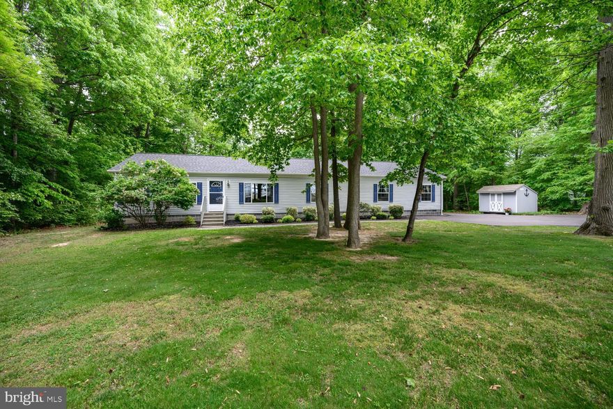 Built in 2009 and offering nearly 2,000 sqft of one-level living, this spacious 3-bedroom, 3-bath home combines an open layout with a desirable split-bedroom floor plan. The kitchen serves as the heart of the home, featuring ample cabinet and counter space, a large breakfast bar and pantry, all overlooking the dining area with sliding glass doors leading to the rear deck and backyard. Just beyond, the inviting family room offers a cozy wood-burning fireplace, while a separate living room is filled with natural light from a large bay window overlooking the front yard and surrounding farm fields. The spacious primary suite features a large walk-in closet and an ensuite bath complete with dual vanity sink areas, a jetted soaking tub and walk-in shower. The second bedroom includes a private sitting room, offering flexibility for guests, hobbies or a home office. A third bedroom, two additional full baths and a separate laundry/mudroom complete the interior. Outside, enjoy a large low-maintenance deck overlooking the backyard, where deer, birds and other wildlife are frequent visitors. Two storage sheds provide ample space for lawn equipment, outdoor toys or workshop space, while a blacktop driveway installed in 2023 adds convenience and curb appeal.  Ideally located just a block from the Queen Anne’s County 4-H Park and less than 5 miles from Centreville Wharf Park, where you can fish, launch a boat, enjoy the playground or relax by the water. Conveniently situated near popular restaurants and amenities in Centreville, Chester, and Kent Island, with an easy commute to Annapolis and less than an hour to BWI Airport.