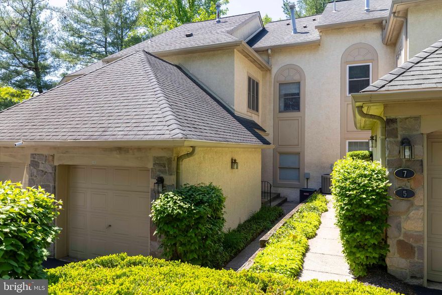 Welcome to 11 Red Oak Drive, a beautifully renovated, and tastefully appointed second floor unit, in the desirable gated community of Breyer Woods. From the moment you enter the community, you will be captivated by the lush, mature landscaping and the peaceful winding streets-perfect for walking your dog or enjoying a leisurely stroll through the development. This spacious sun filled, contemporary second floor home offers vaulted ceiling, skylights, and cozy fireplace that creates a warm yet sophisticated atmosphere. Thoughtfully updated throughout, this stunting unit features handsome luxury vinyl plank flooring, a beautifully renovated kitchen, updated bathrooms, custom lighting, elegant window treatment, and attractive built-in cabinetry that add both character and functionality,  The stylish kitchen featuring crisp white shaker-style cabinetry, quartz countertops, a classic subway tile backsplash and a walk-in pantry/laundry room for added convenience. The great room is an homey and spacious space with soaring ceiling, dining area that is open to the living room  with a French door leading to a private deck with serene tree-top views. The primary suit is conveniently located off the main area and featuring a large bedroom, en-suit updated bathroom and double closets, completing the main level is a guest powder room.  Upstairs, you will find a well-designed second level featuring an additional bedroom, a full bath, a charming library or home office space, and a utilities/storage room. Breyer Woods offers truly carefree living, with condominium fee covering all exterior maintenance, including window replacement, stucco , roofing, walkway, driveway, and garage doors, also included in the association fees all landscaping, snow removal up to the front door, trash collection, insurance and management fee.  This exceptional gated community of 179 townhomes is ideally located just minutes from the SEPTA regional Rail train station, major roadways, shopping, dining and the vibrant heart of Jenkintown-- offering the perfect combination of privacy, convenience, and low-maintenance luxury living.