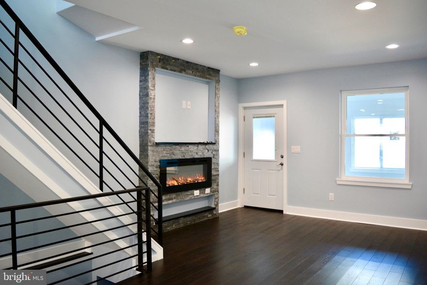 Welcome Home to this Renovation like new construction on a Quiet Block with good neighbors. Enter your enclosed front porch streaming with afternoon/evening light to your Living room with designer statement fireplace mantel/tv mount, open concept dining room space with new wood floors, recessed lighting and flow through to modern and stylish kitchen with two windows granite/stainless steal garbage disposal and windowed door to ample fenced yard. Open stairway to full finished basement with living area, full bath with designer shower and bedroom. Upstairs huge full bath with designer shower and bidet. Hallway closet with stacking washer dryer and two bedrooms with large closets with high ceilings and loads of light. New roof, new heater, HW heater and central air, what more could you ask for? Desireable location easy on /off 95. blocks away from castor/aramingo ave big box shopping Target/Lowes/Home depot/Shoprite, services and fast food. Move in Ready Make your appointment to see your new home today.
