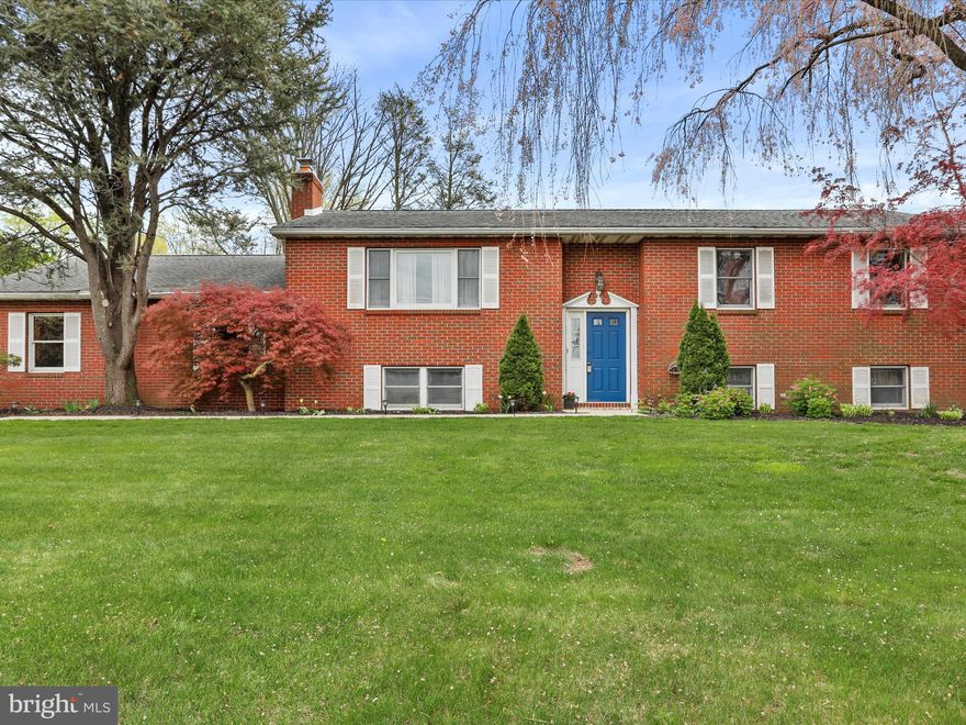 Discover spacious and comfortable living in this well-appointed home offering ample space across two finished levels.

On the main floor, you are greeted by a large living room, but the heart of the home is the beautifully updated kitchen. Featuring elegant granite countertops, a one bowl farmhouse size sink, a stylish tile backsplash, and stunning maple cabinets finished with a coffee color stain. Complete with practical pantry cabinets and durable hardwood flooring, this kitchen includes a stove/oven, microwave and dishwasher.

The main level conveniently houses three bedrooms. The primary bedroom offers plush carpeting, a ceiling fan for comfort, and a private bathroom with a tile floor. The second bedroom features carpeting and a closet, while the third bedroom includes a closet and a ceiling fan. These bedrooms share easy access to the hallway bathroom, which is equipped with a tub/shower combination and tile flooring.

Venture downstairs to the finished lower level, expanding your living options significantly. Here you'll find a cozy secondary living room centered around a charming brick fireplace setup for wood burning – perfect for cooler evenings. It was inspected when owners originally purchased. This level also includes a fourth bedroom with carpet, a full bathroom, and a handy mini kitchenette or wet bar space, adding great potential for flexible use. The laundry room, housing the 50-gallon electric water heater with an expansion tank, is also located on this level, along with a versatile back storage room and a den which could easily function as a home office or library.

Comfort is ensured year-round with an electric forced-air heating system, supplemented by electric baseboard heat, and central air conditioning. Key updates include a roof replaced in 2012 and several updated Andersen windows, including the replaced back slider door.

Outdoor features include a desirable chain-link fenced yard and a large shed that conveys with the property, offering excellent storage solutions. Car enthusiasts or hobbyists will appreciate the attached 3-car garage, complete with overhead attic space, built-in cabinets, and automatic openers for all bays. The home is serviced by a 200 amp electrical system.

Unique Opportunity: Located in retail commercial/professional office zoning, this property allows for potential business use right from home, in addition to being a comfortable residence. Don't miss the chance to own this versatile property offering abundant space and desirable features. Schedule your private tour today!