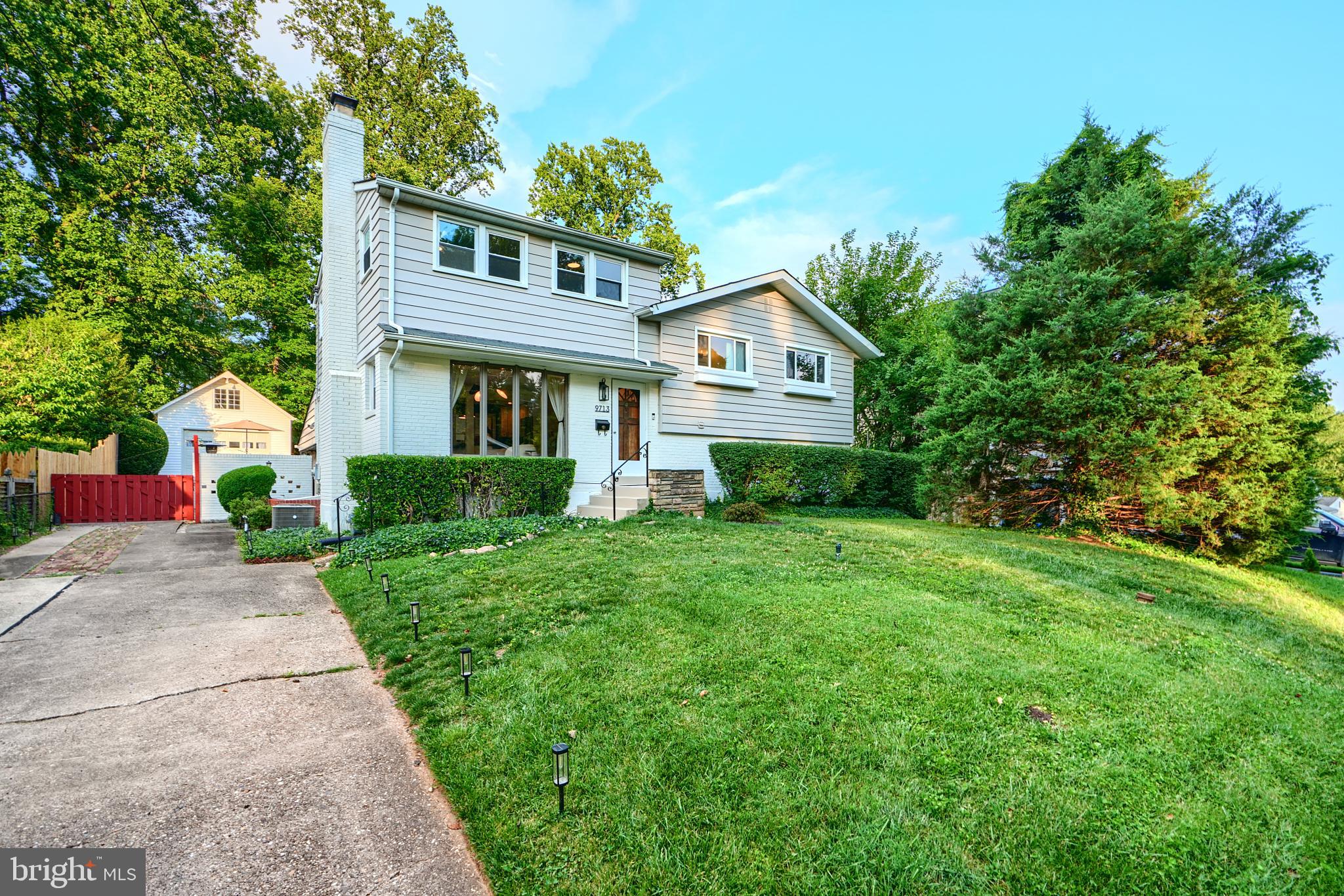 Discover this beautifully expanded and fully updated 5/6-bedroom, 4.5-bath split-level home in Bethesda’s sought-after Fernwood neighborhood. Situated on a 10,500-square-foot lot, this spacious five-level residence is perfect for multi-generational living or working from home.
Inside, enjoy a mix of hardwood, luxury vinyl plank, carpet, and tile/brick flooring, enhanced by recessed lighting, ceiling fans, and a cozy fireplace in the main living area. The modern kitchen features stainless steel appliances, including a dishwasher, microwave, stove, refrigerator, and icemaker.
The upper two levels offer four generously sized bedrooms and three full bathrooms. The lower level includes two more bedrooms, a full bath, and a half bath—ideal for a private suite, home office, long-term guests, or an au pair. The lowest level boasts an expansive recreation room with built-ins, a wine fridge, and space for movie nights or casual gatherings, plus a newly updated laundry room and additional storage.
Outdoor amenities include a covered patio, fire pit lounge, BBQ station, and a versatile side yard ready for a raised bed garden or batting cage. A detached rear-entry garage provides extra parking or storage.
With central air, natural gas heating, and public utilities, comfort and convenience are built in. Located in the highly-rated Walter Johnson High School cluster and minutes from downtown Bethesda, NIH, and I-495, this home is a commuter’s dream in a premier neighborhood.