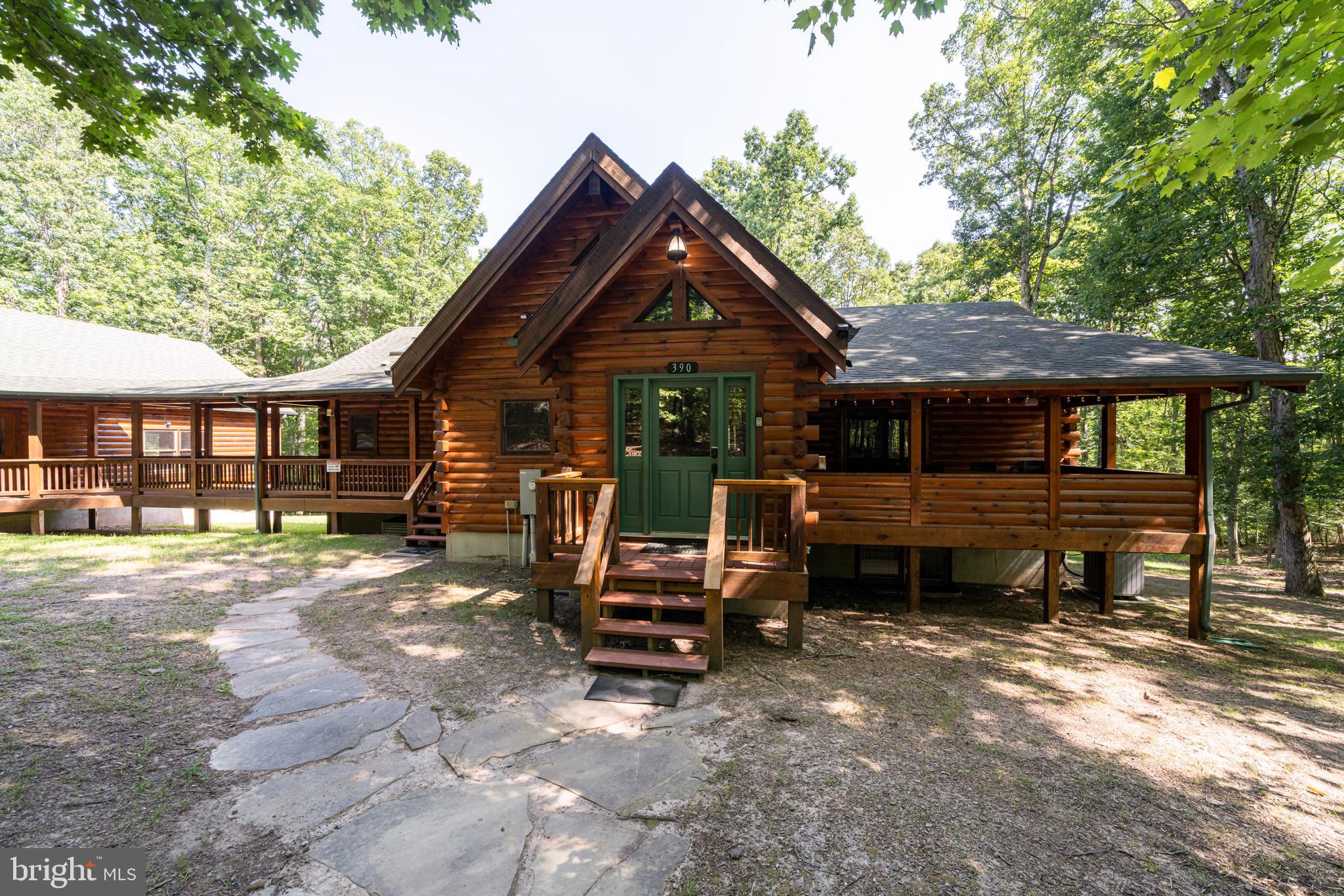 The wait is over! 7.42 acres on a wooded lot stands a custom-built log home, crafted with superior quality and attention to detail. This cozy abode boasts modern comforts. Step inside to discover a fully furnished retreat, thoughtfully designed for immediate enjoyment—the epitome of turnkey living. A well-appointed kitchen invites culinary adventures. Radiant floor heating /heat pump and a backup generator, ensures warmth, power and security if the need arises for your own power. The underground 1000 gallon propane tank keeps you fueled up. Enjoy the weather regardless and never miss a beat with these attributes. 4 bedrooms 2 cedar closets and 4 baths afford privacy, comfort and space for everyone which includes a finished lower level, providing ample storage and additional living space. Gather around the gas fireplace in the heart of the home, where warmth and ambiance abound. Outside, inviting porches and decks beckon for leisurely afternoons spent savoring the sights and sounds of nature. Boiler, hot tub, generator and well pump are new within the last 2 years. The home features a spacious two-car garage and the features go on and on. Make sure you absorb the pictures and schedule a time to view this amazing offering.
If that wasn't enough, consider relaxing in your hot tub and walking the access path to Willet run.