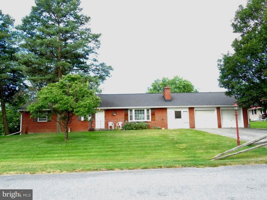 Welcome to Madison Ave!!   All brick rancher in Hamilton Township.  Walking in the front door that leads to the spacious living room with original hardwood flooring and a brick fireplace.  The woodstove insert will convey. The open, well lit  dining area has hard wood flooring and a hand made wooden corner cupboard. The kitchen sports plenty of counter tops and cabinets, also  included are the  refrigerator and  gas range & oven.  Laundry room off of the kitchen, close to the back door.  Washer and Dryer convey.  Three bedrooms with original hard wood flooring.  Oversized 2 car garage with a 31 x 22 workshop addition that is also bricked.  Work benches stay.   Full basement.  A brand new 200 amp panel box installed.  A brand new water proofing system has been installed with transferable lifetime guarantee.