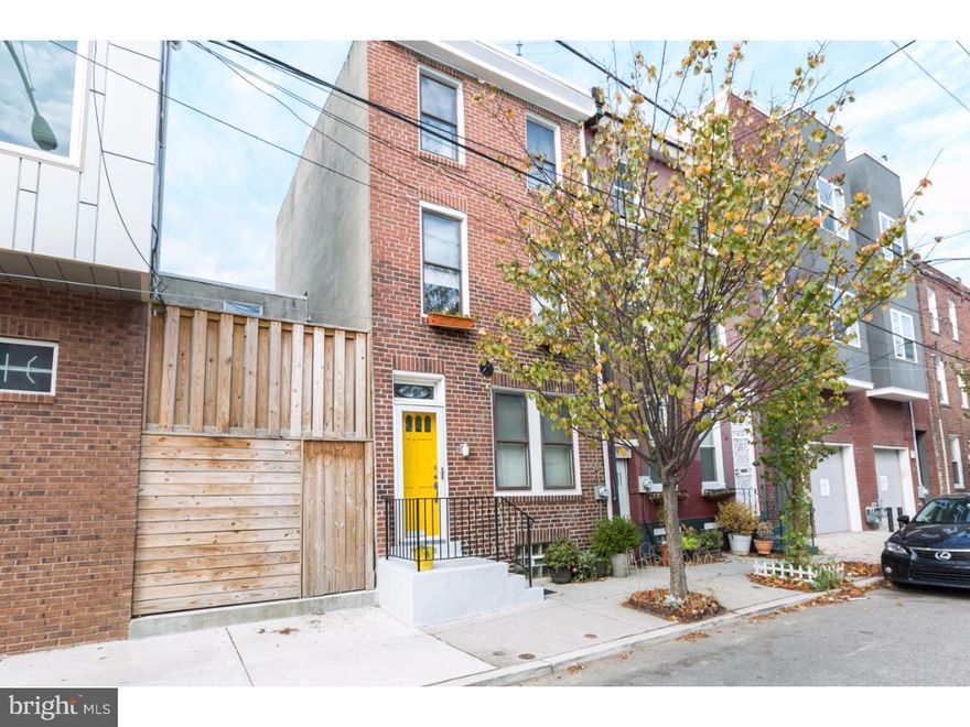A truly unique and charming turn of the century three-story brick front home, with 2 bedrooms, an Artist Live Work Space, located in one of the most exciting parts of Northern Liberties. Enter in through the front door with transom window into the 1st-floor open concept artist studio. This space is enormous with large utility sink, track lighting, and a massive skylight that ushers in tons of natural light. The full unfinished basement with laundry is accessible from the 1st-floor level. The 2nd floor has a spacious eat-in kitchen with a pantry, plenty of white cabinetry and counter space, a ceiling fan, gas range and refrigerator are included.  You will love the look and size of the modern full bath, with dual Kohler sinks, a huge storage vanity, tile floor,  recessed towel nook and the leaded glass bathroom door is an awesome touch! The hallways feature period lighting orb style chandeliers and the original wood banister is in pristine condition. The 3rd floor has two bedrooms, the master, and a 2nd room which is used as a den living room, and both have beautifully refinished pine floors. This home has forced hot air heat, basement laundry included, and tons of interesting details to discover. Incredibly walk-able to cafe's, fitness centers, restaurants, shopping in both Northern Liberties and Fishtown. We welcome your visit today!