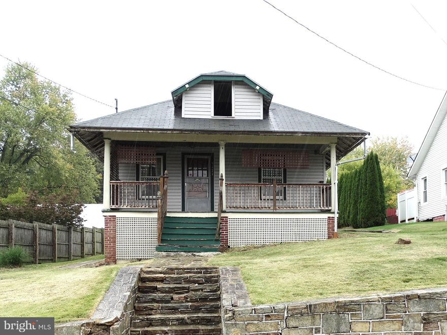 One Floor Living Home With Potential!! 768 Sq Ft Bungalow, located in a quiet Rural area. Features: 2 bed, 1 bath, open floor plan from living room to kitchen, and breakfast bar. Spacious Attic for storage or possible 3rd bedroom! A bit of TLC is what this home needs. Large back yard w/ 720 Sq Ft, 2 car detached Pole building, great for extra storage or workshop. Must see !