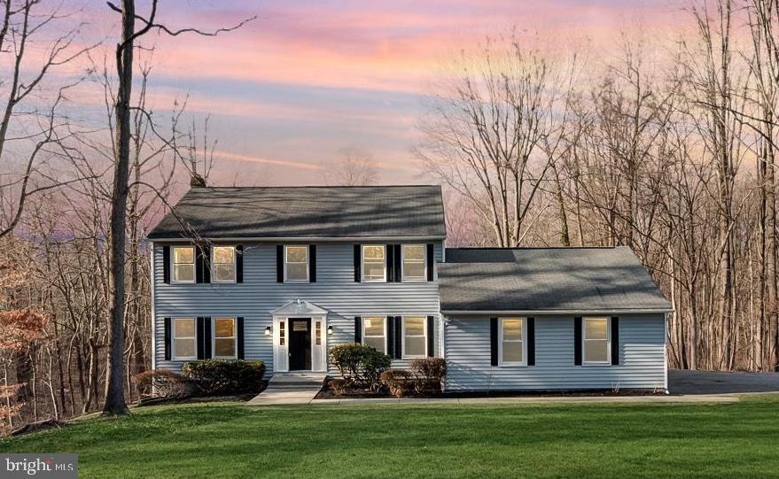 Discover this stunning renovated colonial home nestled in a wooded setting on over 2 acres, featuring a large backyard with an inviting outdoor pool. With three floors of beautifully renovated, naturally lit living spaces that, offer 5 bedrooms and 3.5 bathrooms, this residence offers a true home-away-from-home feeling. The open kitchen, dining and family room combo boasts brand-new quartz countertops and stainless steel appliances, complemented by new luxury vinyl plank flooring, carpet, fresh paint, and windows throughout. Don't miss this remarkable property —capture the opportunity before it's gone!