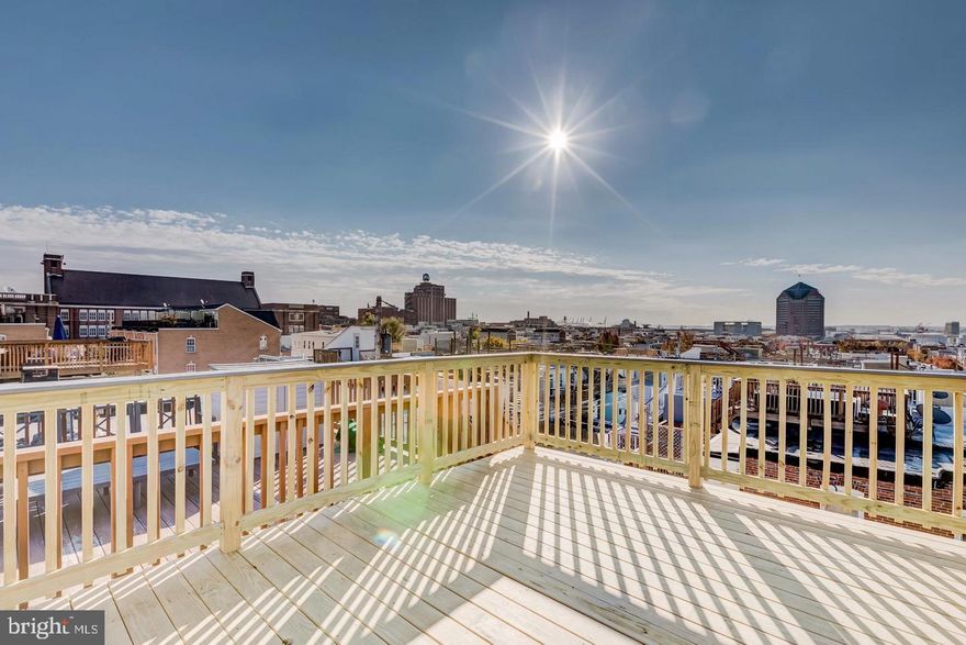 Absolutely beautiful MK/Building Character home in the heart of Canton with over 3 years of CHAP remaining. Completely Wi-Fi enabled home that has been freshly painted. This crisp and bright 4 Bedroom, 3 Bath home with extensive updates sets this home apart from every other home in the city! Gorgeous exposed brick walls accent this home throughout. The main level features beautiful, authentic hardwood floors, gourmet stainless steel appliances, granite countertops and a parking pad for easy access from both sides of the alley. Upstairs you can relax in the quiet, primary bedroom situated in the rear of the home that offers vaulted ceilings, walk-in closet, his-and-her vanities, oversized walk-in shower with glass and granite features! The fully furnished lower level is complete with pristine carpet, a stunning full-bath, and two bedrooms or office and entertainment room with perfectly thought-out french doors. Every inch of the space is completely accounted for. Best and most of all, is the easy access rooftop deck, that offers views of the city that are unprecedented! Other updated highlights include: Front and rear camera system, all rooms include Philips Hue LED lighting, remote access front door dead-bolt, in-home speaker system included in all rooms (even the bathrooms and rooftop deck!), including a gorgeous custom accented pallet wall in the lower level. The perfect street in all of Canton - one way, back-in angled parking, quiet, and best of all - easy access to Fells Point, the Inner Harbor, I-83 and I-95!"