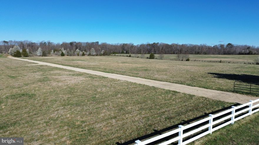 Located in the heart of Spotsylvania, this exceptional 6.25-acre parcel stands out as the largest of four sister lots—offering a rare combination of space, privacy, and potential. Tucked away from the congestion of city traffic yet just minutes from everyday essentials like shopping, dining, healthcare, and top-rated schools, this property strikes the perfect balance between peaceful living and modern convenience.

Set back off Hickory Ridge Road and accessed via the newly established Whispering Meadow Trail (complete with street signage to be installed), the homesite provides a sense of seclusion while remaining easily accessible. With minimal light pollution, you’ll enjoy stunning night skies—ideal for stargazing and unwinding under the stars.

The lot has already been evaluated for a septic system, giving future homeowners a head start on building their dream residence. Three additional 3+ acre adjoining lots are also available, creating even more opportunity for expansion, multi-generational living, or investment.

What truly sets this property apart is the existing barn—a standout feature full of potential. With six stalls, a tack room, wash stall, and hay storage area, it’s perfectly suited for equestrian use or hobby farming. With a bit of vision and effort, this structure can be transformed into a functional and valuable asset, especially with A3 zoning in place to support agricultural pursuits.

Whether you're envisioning a private estate, equestrian retreat, or long-term investment, this property offers the space, setting, and flexibility to bring your vision to life.

*Spotsylvania GIS shows inaccurate location. Main asphalt driveway belongs to neighboring property; the gravel road is Whispering Meadow Trail.
