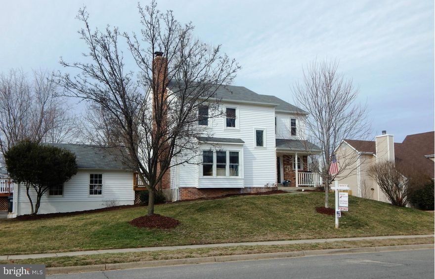 Beautifully remodeled 1st  floor plan, creates a wonderful open Great Room! LR & Dr walls removed! Cozy fam. rm w/fp off of kitchen. Hardwd floors! All baths have been updated. 4 spacious  bedrooms upstairs.  Finished lower level with rec. rm and game rm w/ walkout to backyd.  Huge  2 car detached garage. Freshly painted! New Carpet! Large deck, fenced yd  No HOA