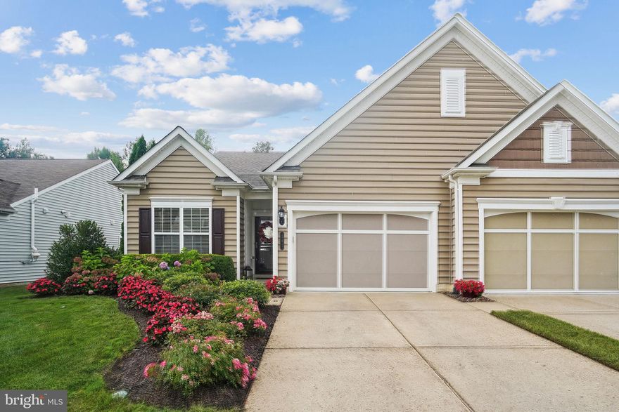 This delightful end unit villa in the Premier Del Webb 55+ Community of Celebrate Virginia is now available for sale! Welcome to this charming home, located in the highly sought-after Del Webb 55+ active adult community of Celebrate Virginia. Ideally positioned just a short stroll or golf cart ride from the exclusive Celebrate Riverside Lodge, this home offers a lifestyle enriched with a plethora of amenities and conveniences.

This beautifully designed end unit features an open floor plan bathed in natural light and adorned with elegant finishes. The family room, complete with a cozy natural gas fireplace and stylish shiplap accent wall, creates an inviting space perfect for both relaxation and entertaining. The heart of the home is a contemporary kitchen outfitted with sleek stainless steel appliances, quartz countertops, composite granite sink, and a ceramic backsplash. The large breakfast bar is ideal for casual dining or meal preparation while entertaining. For those who enjoy cooking, the gas stove will be a standout feature! Across from the kitchen is the perfect office/craft/sitting room that features French doors for quiet conversations and adds another flex space for you to make your own.

The spacious primary bedroom suite offers a peaceful retreat with a private bath, generous closet space, and a lovely view of the backyard. It’s enhanced by neutral paint, a tray ceiling with recessed lighting, and a calming atmosphere. A second bedroom and full bathroom, located at the front of the home, provide a private space perfect for guests.  

Step outside to enjoy the private patio, perfect for al fresco dining, gardening, or simply unwinding amidst tranquil surroundings. Colorful landscaping added by the owners enhances the outdoor appeal and creates a vibrant, welcoming atmosphere. 

The owners have done many upgrades including the kitchen upgrades in 2020, luxury vinyl plank expanded in the home in 2019, replacement roof in 2022,  and new water heater in 2021. All the work has been done for you! Move in and enjoy a worry-free life. The laundry room is located on your way to the two car garage and the washer & dryer convey with the home. The garage features additional storage space in the unfinished attic, accessed by pull-down stairs. This home design is perfect for downsizing while providing all the comforts you need.

Just a short distance from the 30,800 square foot Riverside Lodge, residents have access to a rich array of physical and social activities within the heart of this vibrant community. The Riverside Lodge features a fitness center and indoor walking track, an indoor pool and spa, a ballroom with a demonstration kitchen, a billiards room, and a fireside library and lounge. Enjoy tennis and pickle ball courts, bocce ball courts, and an outdoor amphitheater ideal for evening concerts. Gardening plots are available and scenic parks and natural spaces surround the community, offering ample walking and biking trails. A full-time Activities Director plans a variety of social activities and trips to educational and entertainment destinations, ensuring that there’s always something to look forward to.

This villa perfectly blends comfort, convenience, and vibrant community living, providing an ideal setting for an active 55+ lifestyle. Don’t miss your chance to experience the best of Celebrate Virginia!