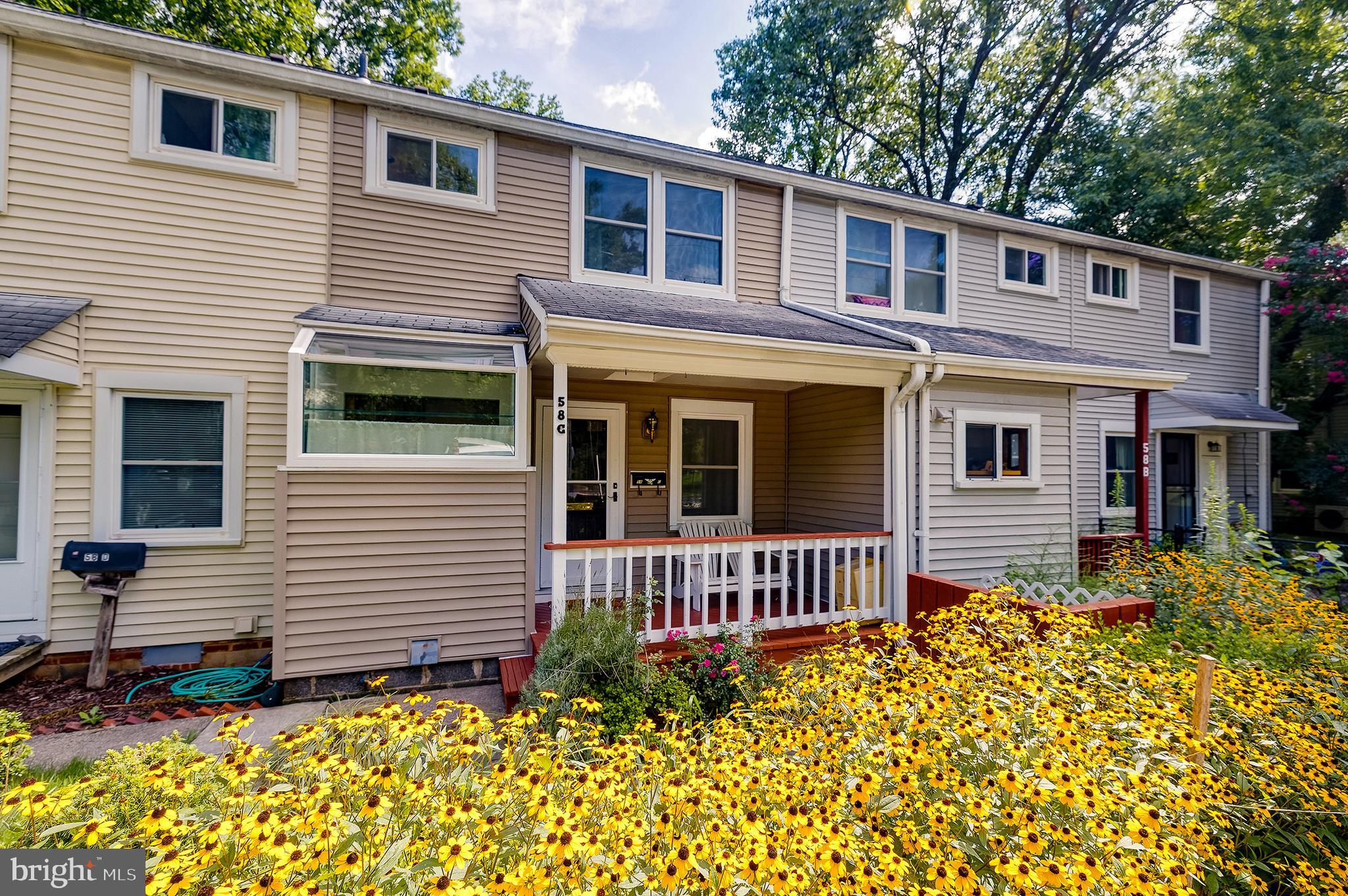 This charming townhome, part of Greenbelt's community of cooperative homes, has a very smart addition that includes a second full bath. It also has a kitchen bump-out with extra windows to bring in more light and extra workspace. Architectural details including an opened-out kitchen with an island, a closet cut out of the space under the stairs, and even a small pass-through window from kitchen to living area, create a fun, quirky appeal. This home backs to the Greenbelt Forest Preserve, and it has a covered front porch and a sunny, cheerful flower garden facing the street. This one is a find!
Reach out to co-listing agent Andrew Nugent for any questions. This is a co-op, see http://ghi.coop for information about the community. Co-op fee is estimated. Cash or conventional financing only, with GHI approved lenders. Co-op fee includes PROPERTY TAXES, insurance, and major exterior and interior maintenance.
