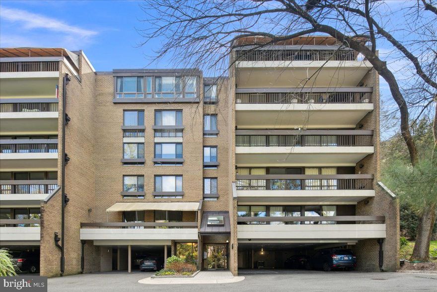 OPEN HOUSE HAS BEEN CANCELLED.  UNDER CONTRACT.  Welcome to luxury living at its finest in sought after Sumner Village in the heart of Bethesda. Spanning almost 2,200 square feet, this exquisite residence boasts two spacious bedrooms, a den with custom built-ins and two and a half bathrooms, meticulously renovated to provide a sophisticated living experience.

Step inside to discover beautiful hardwood floors that seamlessly flow throughout the open-concept living areas. The centerpiece living room features a wood-burning fireplace with a stunning marble surround, perfect for cozy evenings. The modern eat-in kitchen is a chef's dream, equipped with high-end Bosch appliances, including an induction cooktop, and abundant custom cabinetry, catering to both culinary enthusiasts and those who love to entertain. The large dining room is the perfect space to entertain guests. A lovely balcony overlooking the tree-line is the perfect space to enjoy the warm spring evenings. 

A large den with custom built-in desk and shelving functions as an office or could be a third bedroom. A half bath room is tucked just beyond the main entryway. A large laundry room offers additional storage, while two hall closets function as storage and a coat closet. At the end of the hall is a full marbled bathroom, just off the second bedroom. The large ensuite bedroom offers a dressing room area with three large closets and an ensuite bath featuring double sinks and marbled shower. The ample closets are all custom fitted with Elfa closet systems. This home comes with two covered parking spaces (tandem) and a large storage room. 

Sumner Village offers a suite of premium amenities: unwind in the sauna or take a dip in the pool; maintain your fitness regime in the well-equipped gym; or challenge friends at the tennis court. For your convenience, the building also offers elevator access.

Conveniently located next to The Shops of Sumner Village offering easy access to shopping, restaurants and Safeway. Just beyond Sumner Village are the Capital Crest and Little Falls Stream trails providing a tranquil environment just outside your door. Easy access to all that Downtown Bethesda and DC have to offer.