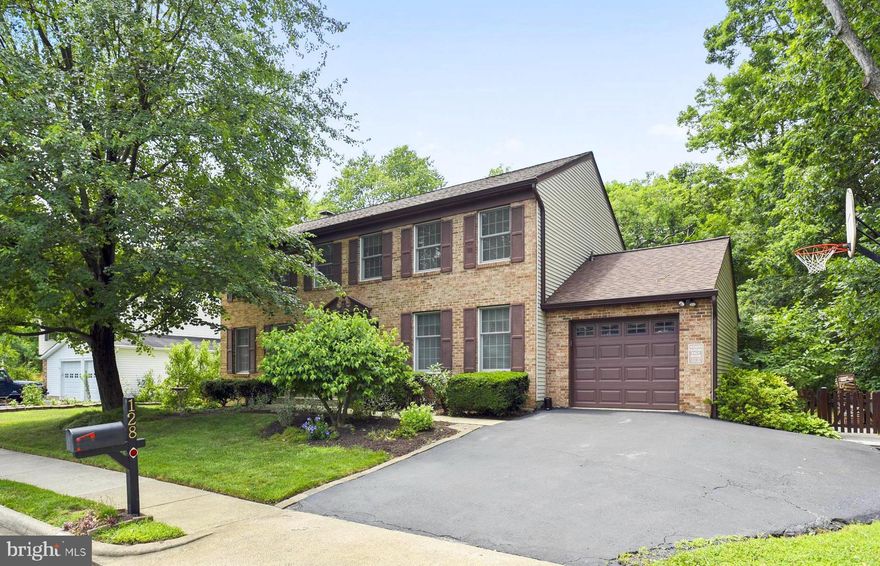 Don't miss your opportunity to own in the highly sought-after Forest Ridge neighborhood! This absolutely charming home has been filled with love and laughter for many years. Past the gorgeous landscaping outside, walk inside to an open floor plan and hardwood floors on the main level. Separate dining room with chair rail and crown molding, spacious formal living room, and family room with a lovely wood-burning fireplace. There is a nice breakfast/eating area off the kitchen which leads out to a gorgeous screened-in porch complete with its own ceiling fan! The screened porch leads out to an open deck area for grilling, and steps down to a paver patio and fully fenced back yard with play equipment. Upstairs in this home you will find four spacious bedrooms and two full baths. Even the smallest bedroom is large enough for a queen or king bed! The master bedroom includes an en-suite bath and walk-in closet. The master bath has a vanity area separate from the shower to make the morning routine easier. The second bedroom has a wonderful view of the back yard and a big walk-in closet. ALL BEDROOMS INCLUDE CEILING FANS. Don't forget about the bonus space in the basement, which includes a private office, large recreation area, and a "man cave" complete with bar. But that's not all. There is also a very spacious storage area! Bathrooms updated, ROOF REPLACED in 2019, HVAC replaced in 2014, and freshly painted main level and bedrooms! Over 3,200 square feet of living space!