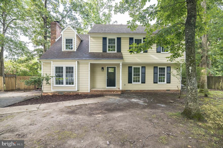 Welcome to this 4 bedroom 2 bath home surrounded by trees. Walk into a light and bright foyer with wood floors flowing throughout the main level. The living room to your right includes crown molding and chair railing and easily flows into the dining room with center chandelier and sliding glass door to the large back deck. The kitchen provides plenty of counter space, cabinet space, stainless steel appliances and feature wood ceiling. The wood ceiling continues into the breakfast nook with bay window over looking the back yard. The family room includes cozy brick fireplace, built ins and over sized window. Retreat to the primary suite with walk in closet and en-suit with tub shower. 3 bedrooms and hall bath complete the level. Easily entertain outside in the oversized deck overlooking the back yard.