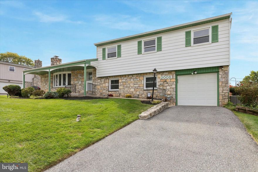 Nestled in the desirable Westover Woods community, this lovingly maintained split-level Colonial offers 3 bedrooms, 2.5 baths, and a comfortable, easy-flow layout. The main level welcomes you with an oversized living room featuring a wood-burning fireplace and bow windows that fill the space with natural light, along with a formal dining room perfect for gatherings. Newly refinished white oak flooring adds warmth and character to both the living and dining areas. The updated eat-in kitchen is the heart of the home, complete with soft-close cabinets, a tiled backsplash, gas cooktop, built-in microwave, dishwasher, and double wall oven are ideal for everyday living and entertaining. Just off the kitchen, the sunroom provides a bright and relaxing space to unwind or host guests. Upstairs, you’ll find three spacious bedrooms, all featuring white oak flooring beneath the carpeting. The primary suite includes a private en suite bath and a walk-in closet.  A hall bath serves the additional bedrooms. The lower level offers flexible space for a den, playroom, or media room, along with a convenient laundry area. Outside, enjoy a fenced, level 0.28-acre yard perfect for outdoor activities, gardening, or simply relaxing. The rear patio is ideal for outdoor dining, and a storage shed adds extra convenience. Additional features include an attached one-car garage with inside access and a location convenient to shopping, dining, golf, and major roadways.