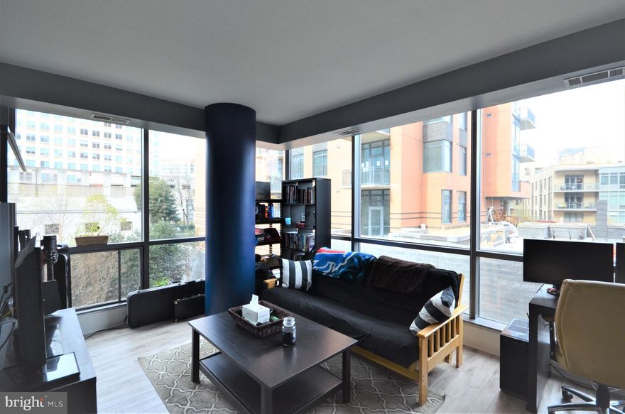 Beautiful Corner Condo at the Odyssey! Bright and airy one bedroom with floor to ceiling windows and courtyard view features wood flooring, neutral paint, balcony, and garage parking.  Kitchen has granite counters, stainless steel appliances, and floating island.  Spacious dual entry bath has separate washer and dryer. The Odyssey is a secure luxury building with rooftop terrace, pool, gym, party room, and more. Excellent location: 0.2 miles to Courthouse Metro, walk to restaurants, shopping, entertainment, and parks. Minutes to DC or Pentagon/Crystal City.