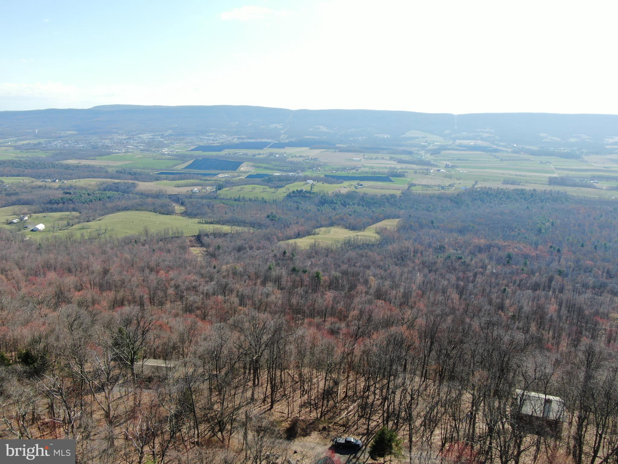 MILLION DOLLAR VIEWS! Some of the most incredible views in Fulton County can be found on this parcel of land! .24± acres just minutes to Meadow Grounds Lake and State Game Lands 53! Close proximity to McConnellsburg, Rt 16, 522, and Rt 30! Established cabins stretch through this gorgeous area. This auction is for .24+- acres but may include an additional parcel of approximately 28,000 square feet. The additional parcel is not guaranteed to be part of the sale. No survey has been completed on this property, in order to guarantee accuracy a survey would have to be completed. Property is being sold as-is. This property will be offered at auction on Wednesday, April 10, 2024 @ 4:30PM.