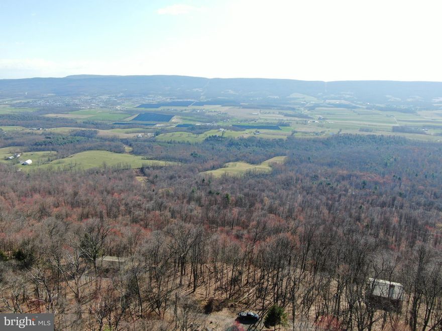 MILLION DOLLAR VIEWS! Some of the most incredible views in Fulton County can be found on this parcel of land! .24± acres just minutes to Meadow Grounds Lake and State Game Lands 53! Close proximity to McConnellsburg, Rt 16, 522, and Rt 30! Established cabins stretch through this gorgeous area.  This auction is for .24+- acres but may include an additional parcel of approximately 28,000 square feet. The additional parcel is not guaranteed to be part of the sale. No survey has been completed on this property, in order to guarantee accuracy a survey would have to be completed. Property is being sold as-is. This property will be offered at auction on Wednesday, April 10, 2024 @ 4:30PM.