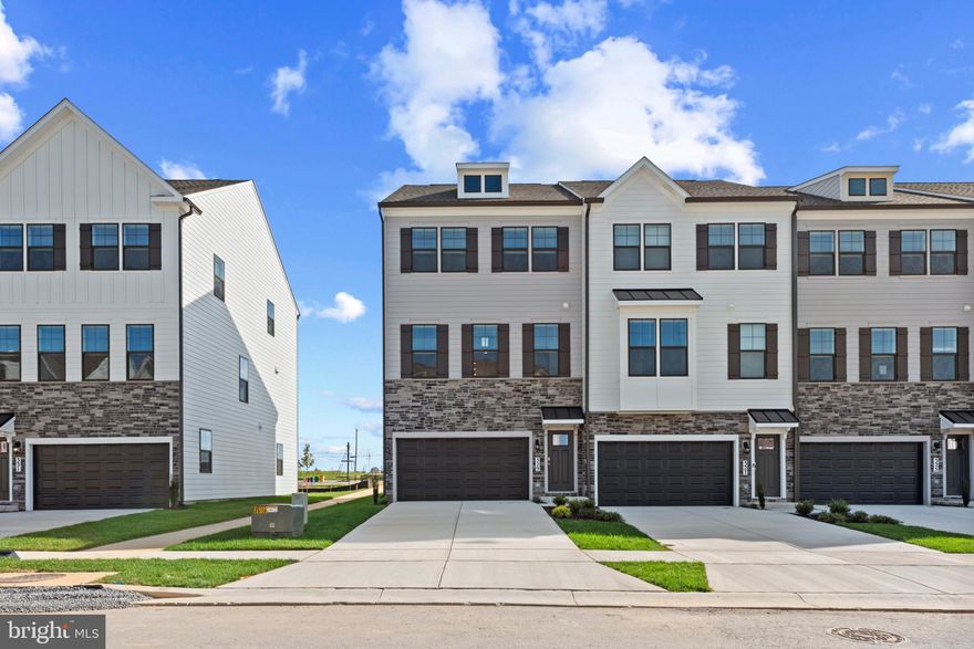 Brand New Auburn Townhome at D.R. Horton’s Renn Quarter – Your Dream Home Awaits! Welcome to the stunning Auburn townhome plan, now available at the highly sought-after Renn Quarter in Historic Downtown Frederick, MD. With over 2,270 square feet of spacious living, this beautiful 4-bedroom, 3.5-bathroom home with beautiful deck and fencible backyard offers modern living with unbeatable convenience and style. Renn Quarter is an amenity-rich lifestyle community that perfectly blends the charm of downtown Frederick with brand-new, modern homes. The Auburn plan is designed for the way you live today, featuring soaring 9-foot ceilings, a standard gourmet kitchen with sleek stainless-steel appliances, and luxurious plank flooring throughout. The open-concept layout flows effortlessly from the kitchen to the spacious living areas, creating the perfect space for both family time and entertaining guests. Your new home boasts a spacious master suite with a luxurious master bath and walk-in closet, providing the perfect private retreat. The Hardwood Stairs, Bedroom Level Laundry Room, and 2" blinds add even more ease and comfort to your daily life. Located in the Newly released section of D.R. Horton’s Renn Quarter, this home is just a short walk or bike ride to all the best shopping, parks, dog parks, and dining in downtown Frederick. Enjoy the future Carroll Creek Walkway Extension right outside your doorstep, along with the open spaces, trails, and creeks that Renn Quarter will offer. This is the last residential community in the area that will be considered walkable downtown, providing you with a truly unique blend of convenience and modern living. Whether you’re relaxing at home or out enjoying the vibrant downtown, Renn Quarter offers it all. This home is ready for you to call it your own! Contact us today to schedule a showing and let us help you make your dream home a reality.