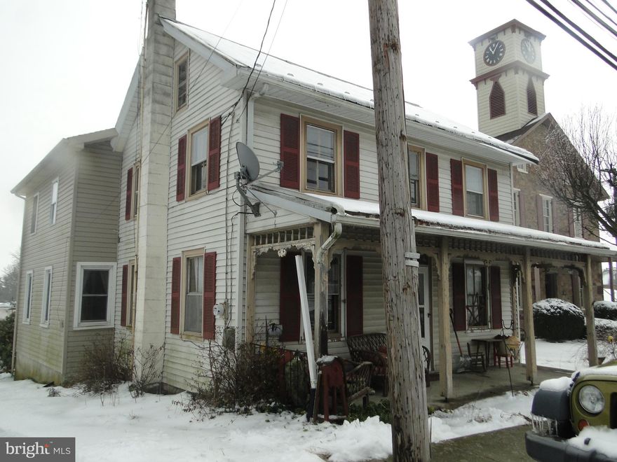 Bring your vision to this home. It had a large addition put on & it all needs finished. There is a detached garage, a fenced in yard, deck & koi pond. The driveway is shared & it is in the deed.