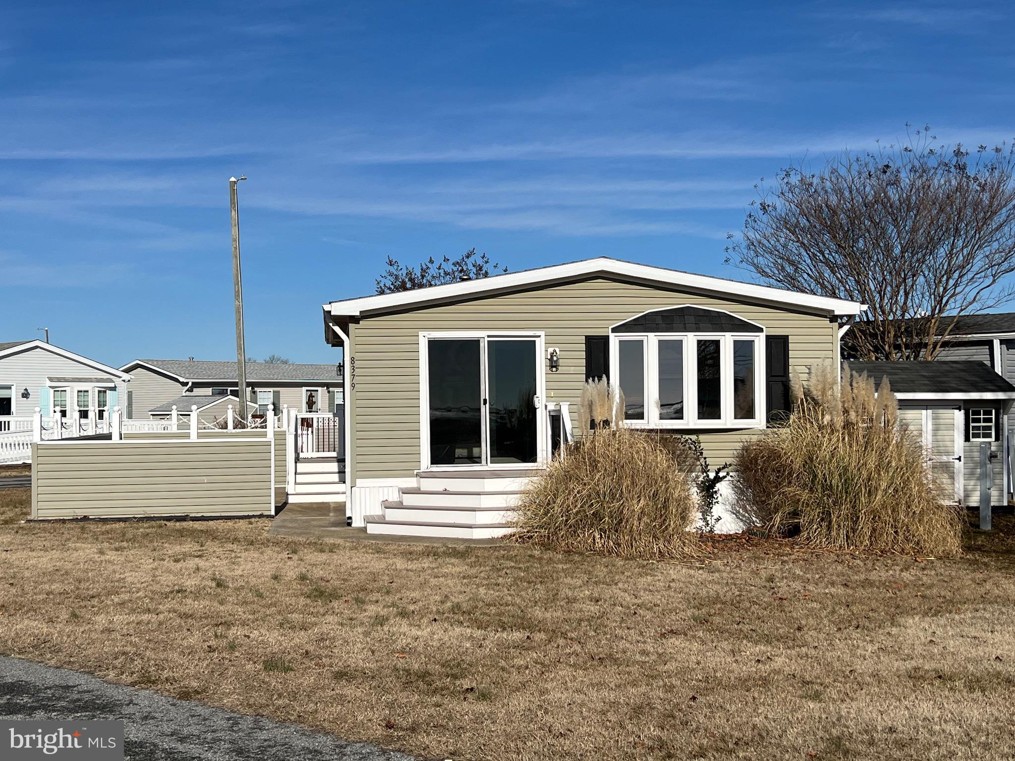 Spectacular Bay View! 2 Bedroom Cottage with with Million Dollar View of Assateague Island, Sinepuxent Bay & 1000ft. Fishing & Crabbing Pier! This cottage has Drywall Interior, Cathedral Ceilings, Skylights & Updated Bow window in Dining Area. Spacious Kitchen with Gas Stove , Dishwasher, Built in Microwave & Refrigerator. Full Size Washer/Dryer in Laundry Room. This home is on a Corner Lot with a Courtyard with Bay Views & a 8 x 10 Shed.