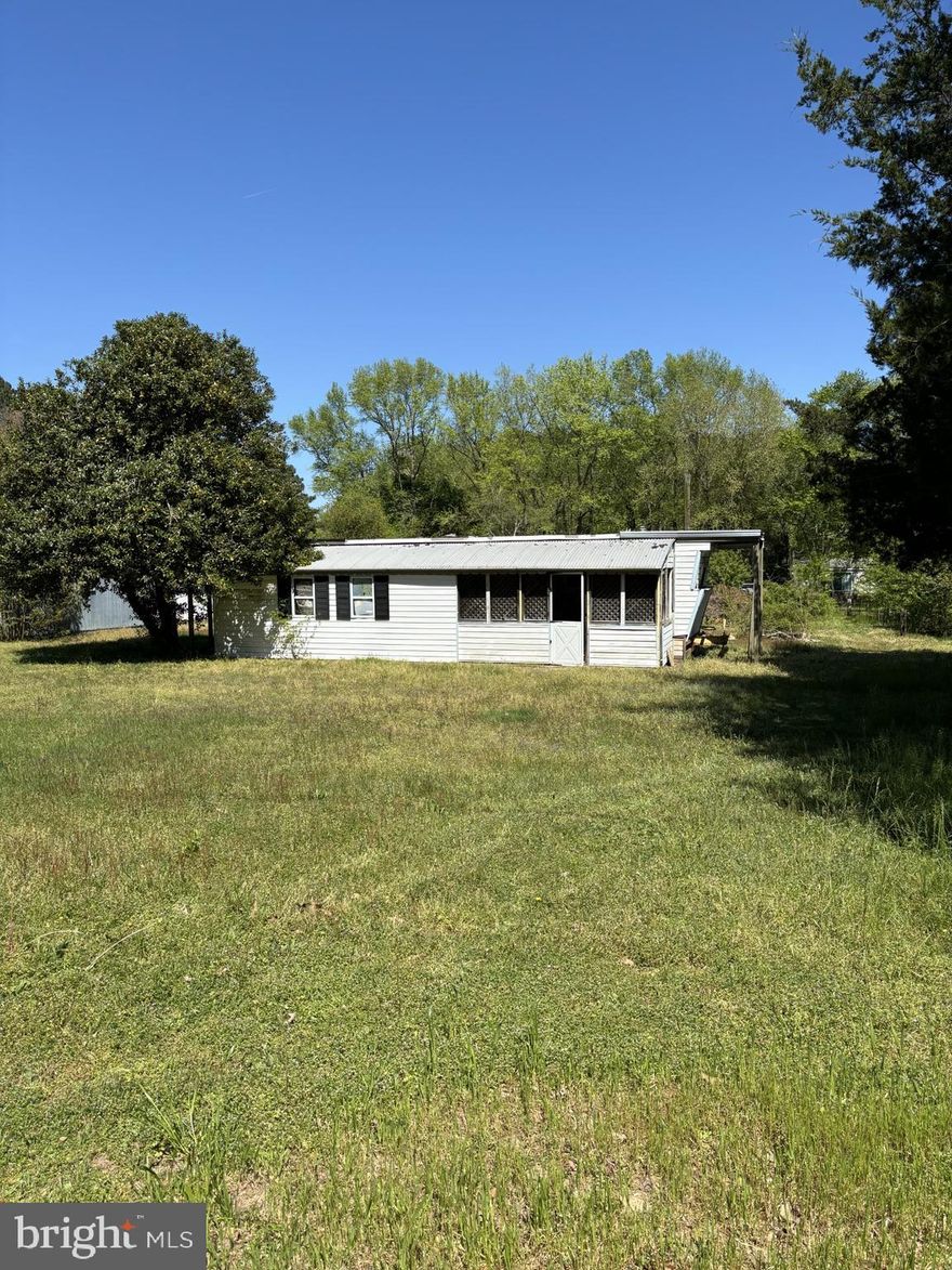 Imagine having your grandkids stay for the entire summer.   Years later, those grandkids grow into adults still making this their vacation home.  Add a pond and an above ground pool to the grounds.  The possibilities are endless for this lot, only 35 minutes to the beach.  This property is a nice flat 1/2 acre lot on which you can build the home of your dreams.  Just 35-40 minutes to the beach! Property is being sold as-is and has a mobile home in need of removal on it currently.